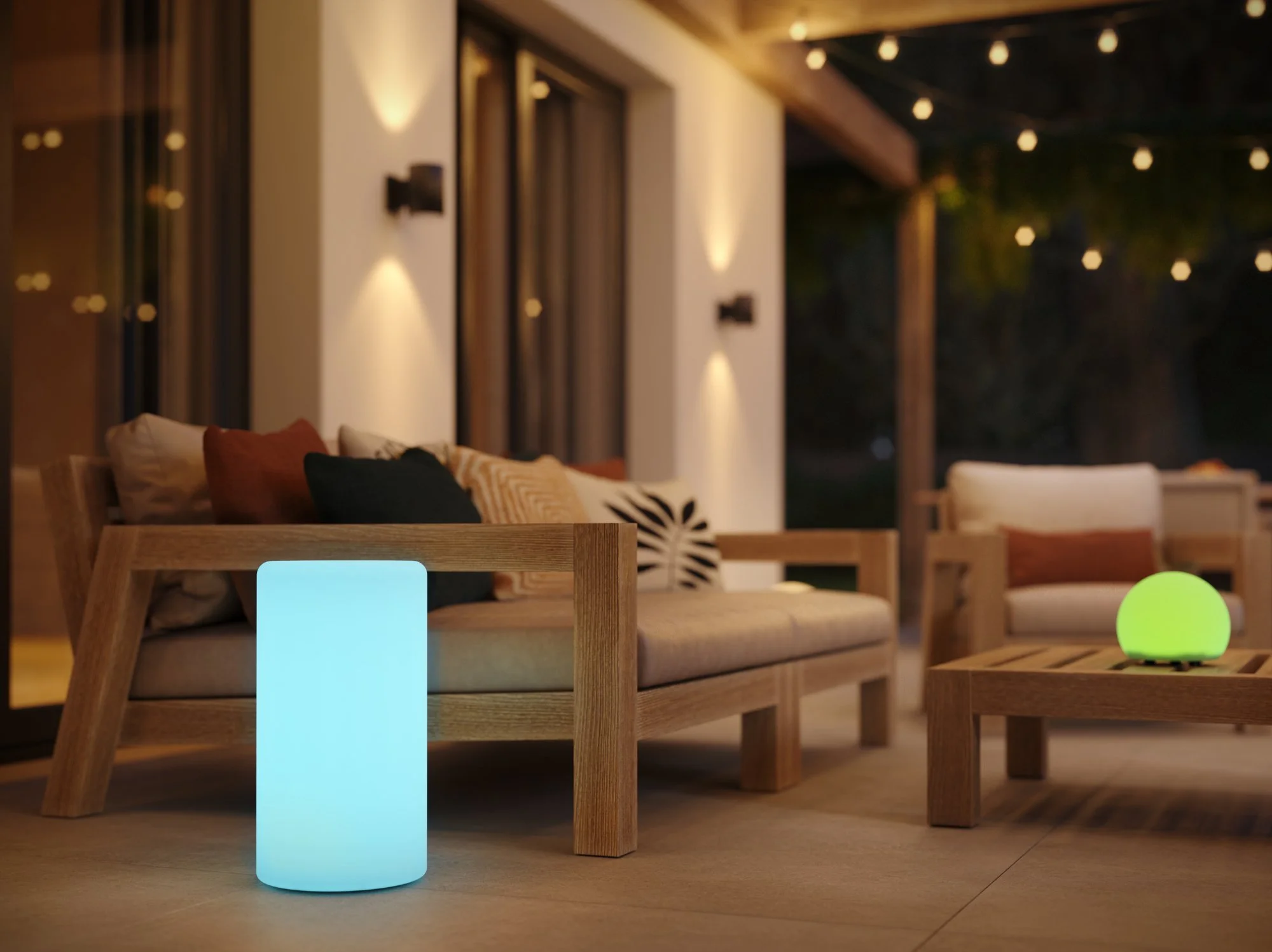 Modern outdoor wall light with an elegant marble design illuminating a contemporary patio seating area.