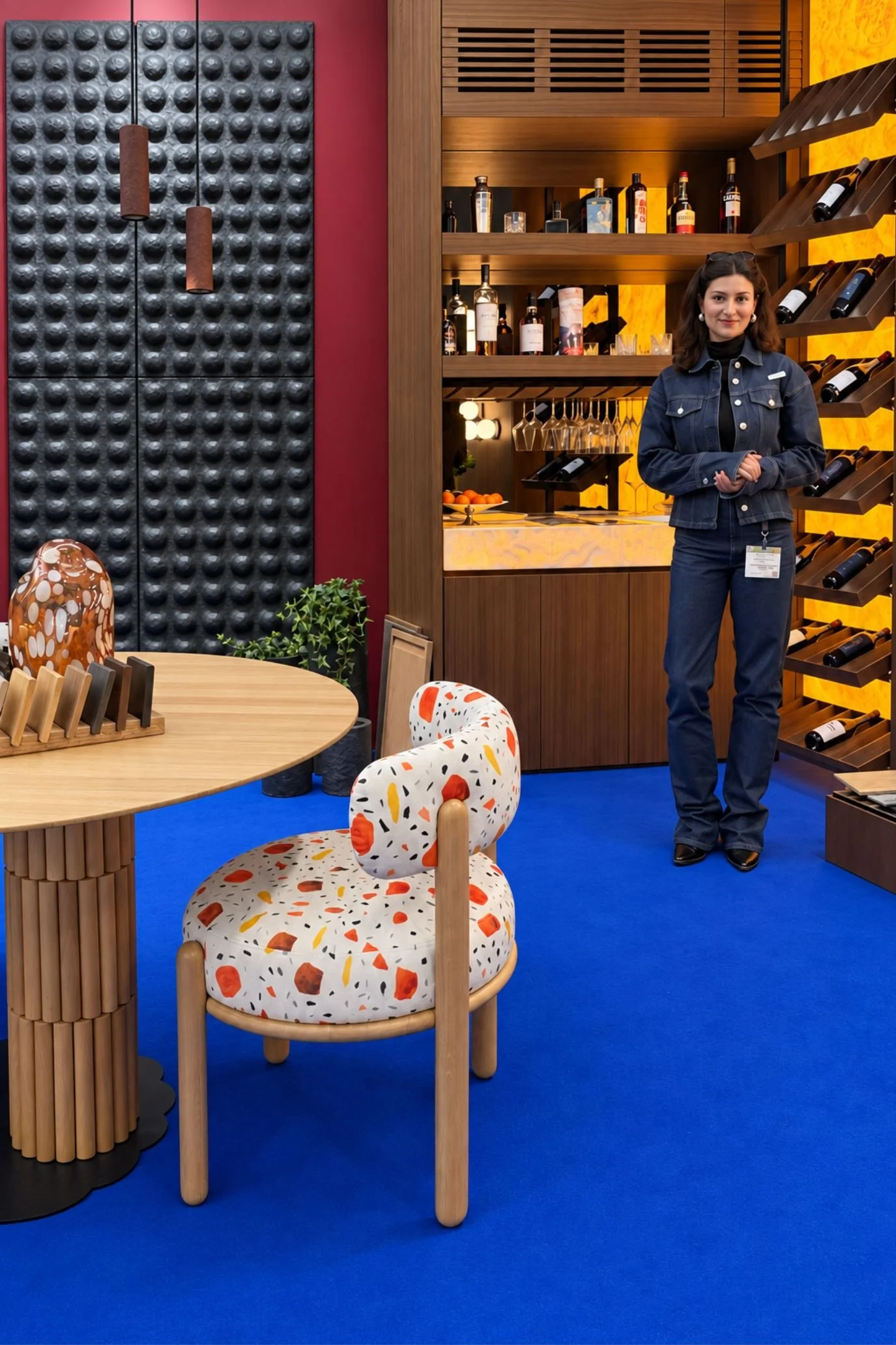 Ukrainian stand	Ukrainian furniture display with a round wooden table, colourful upholstered chair and illuminated drinks cabinet.