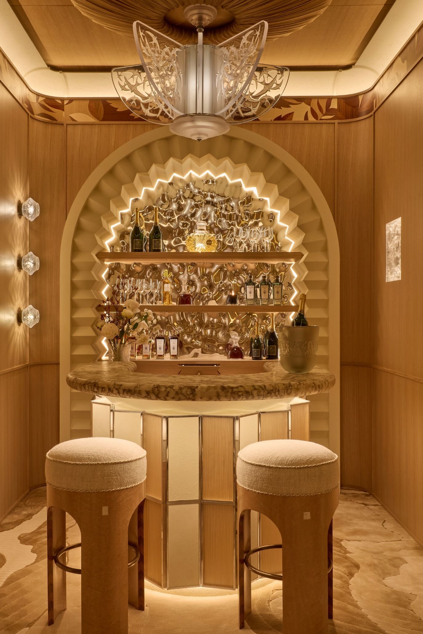 Luxurious, opulent and stylish home bar with counter, shelving and drinks display