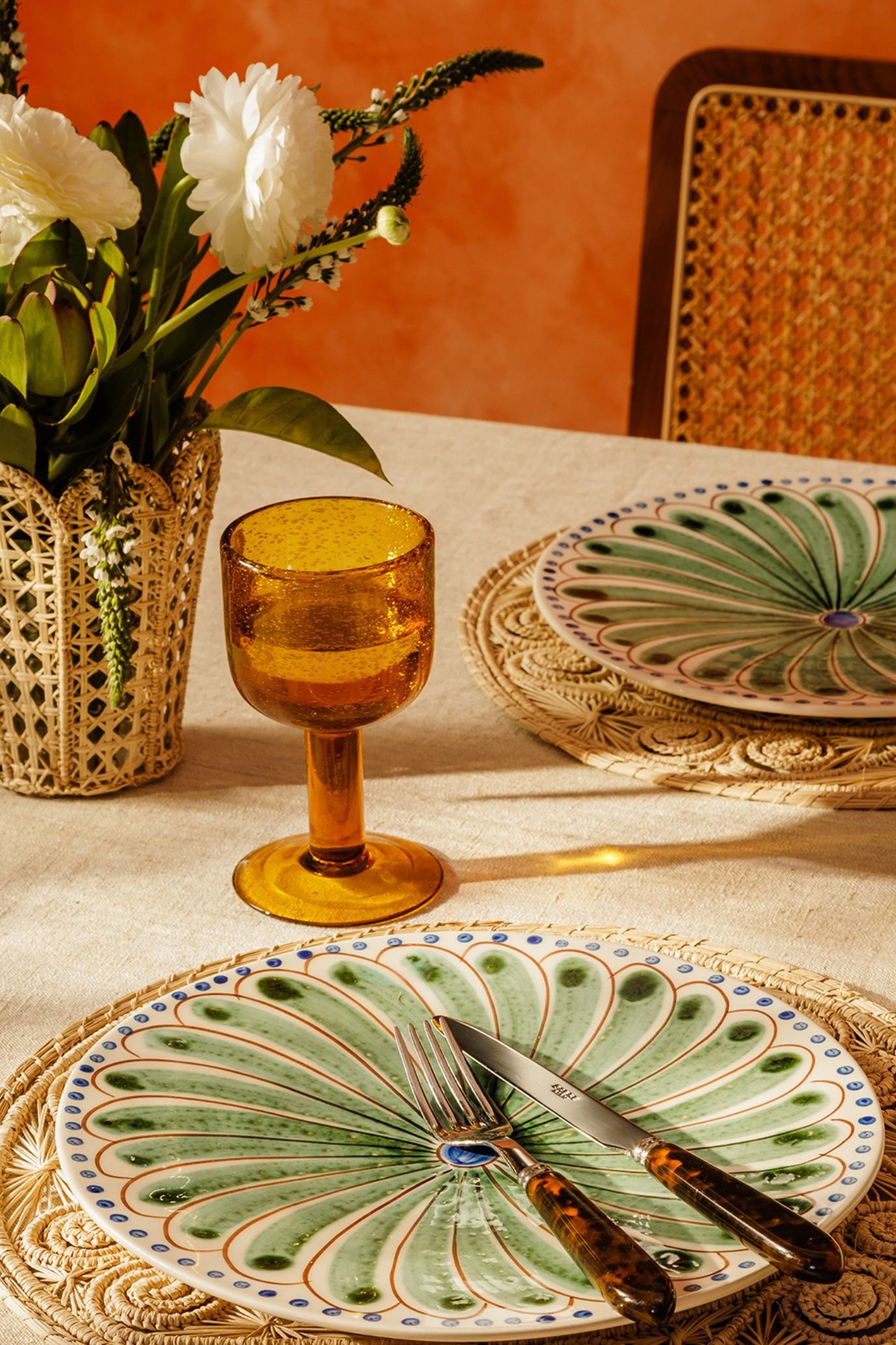 Hand-painted ceramic dinner plates with green botanical motifs from Caldas da Rainha.