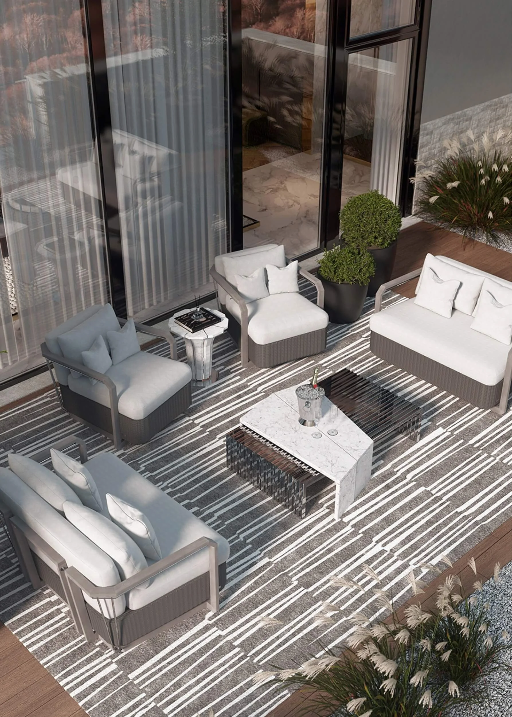 Stylish outdoor rug in beige and white contemporary print with beige chairs and sofa with cream plain line cushions and an outdoor marble coffee table.