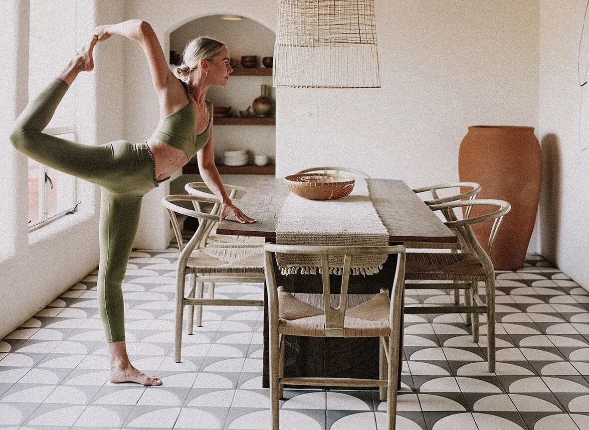 Girl in a yoga pose in the dining room at the JTH Tucson