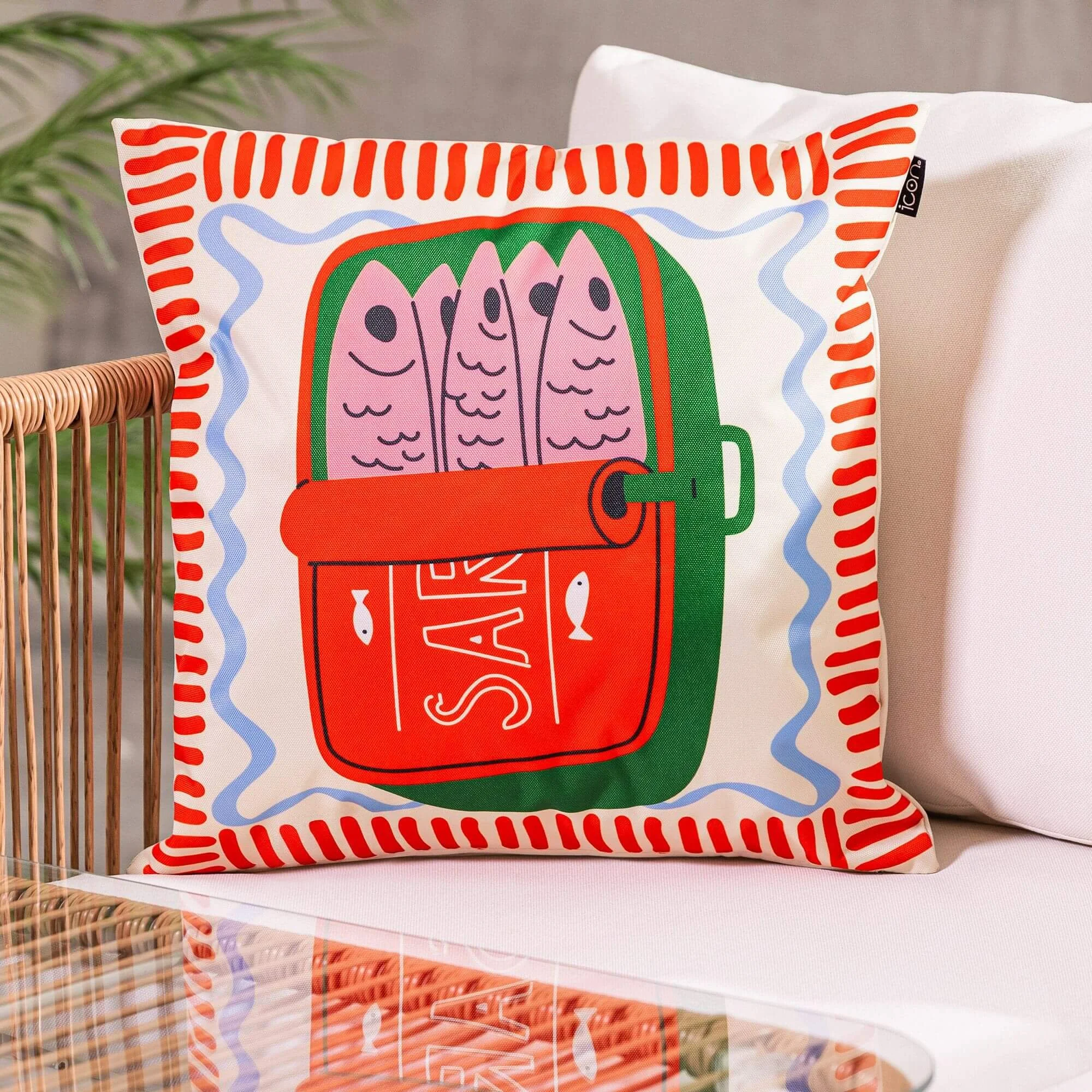 Whimsical printed outdoor cushion with a sardine design and red border detail