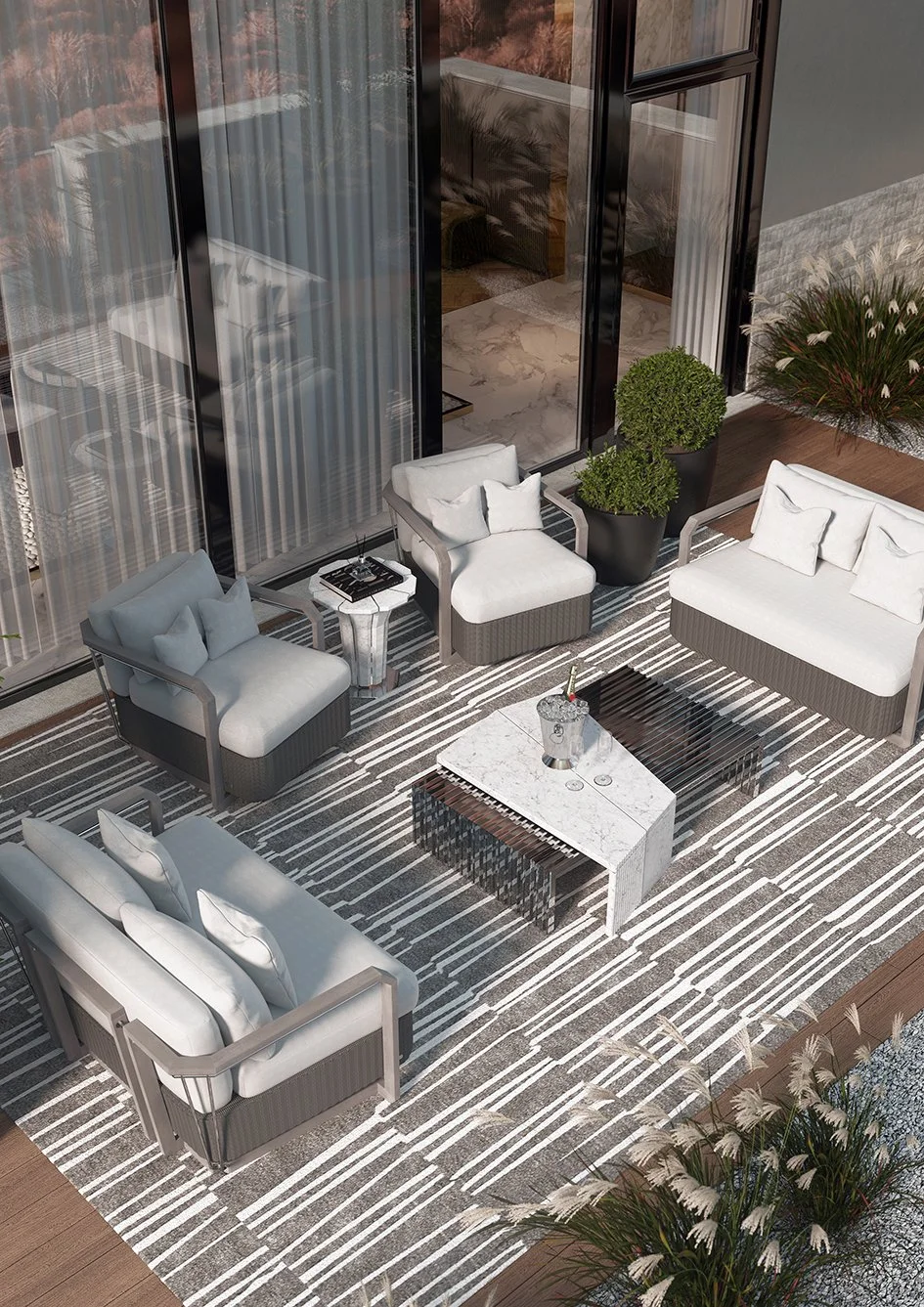 Stylish outdoor rug in beige and white contemporary print with beige chairs and sofa with cream plain line cushions and an outdoor marble coffee table.