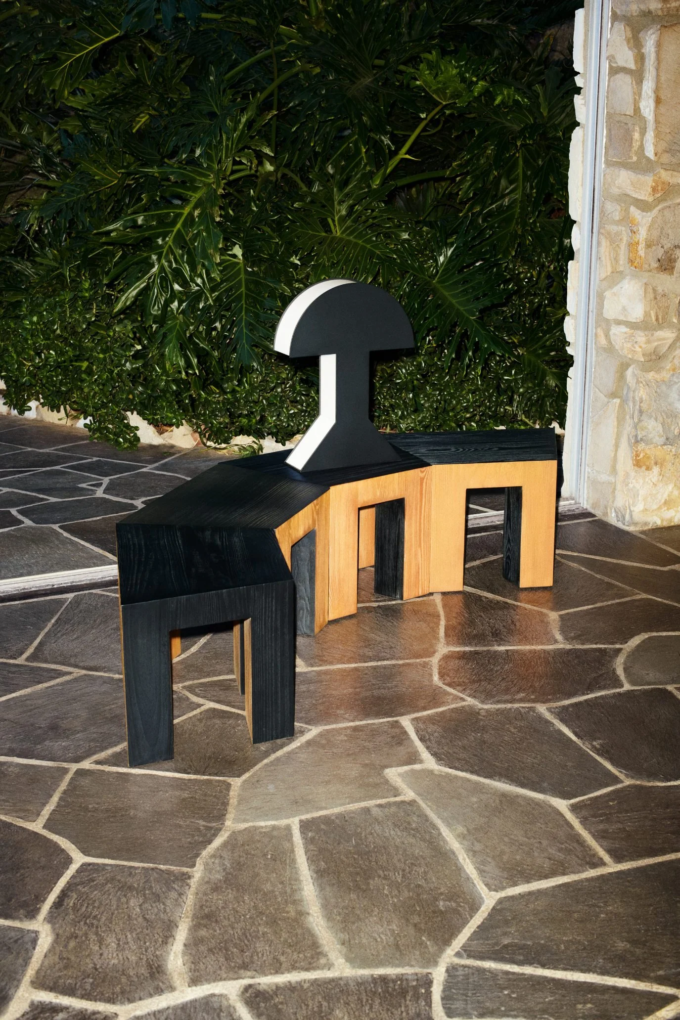Black and natural wood sculptural pieces with the geometric AUREX metal lamp from H&M HOME
