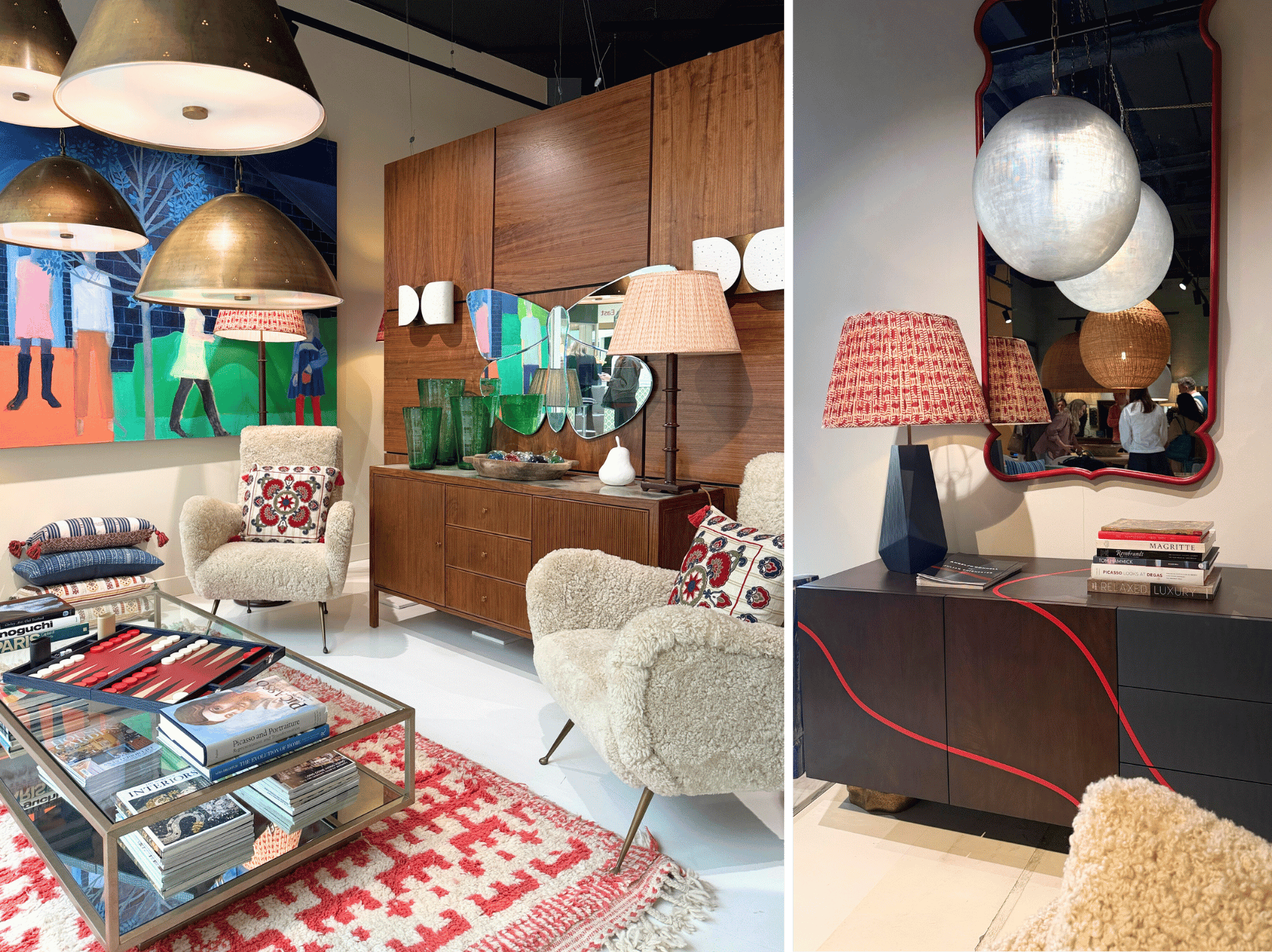 A showroom with a red rug, glass coffee table filled with books, two cream wool chairs and brass pendant lights. On the right is a sideboard in dark wood and red with a lamp on top