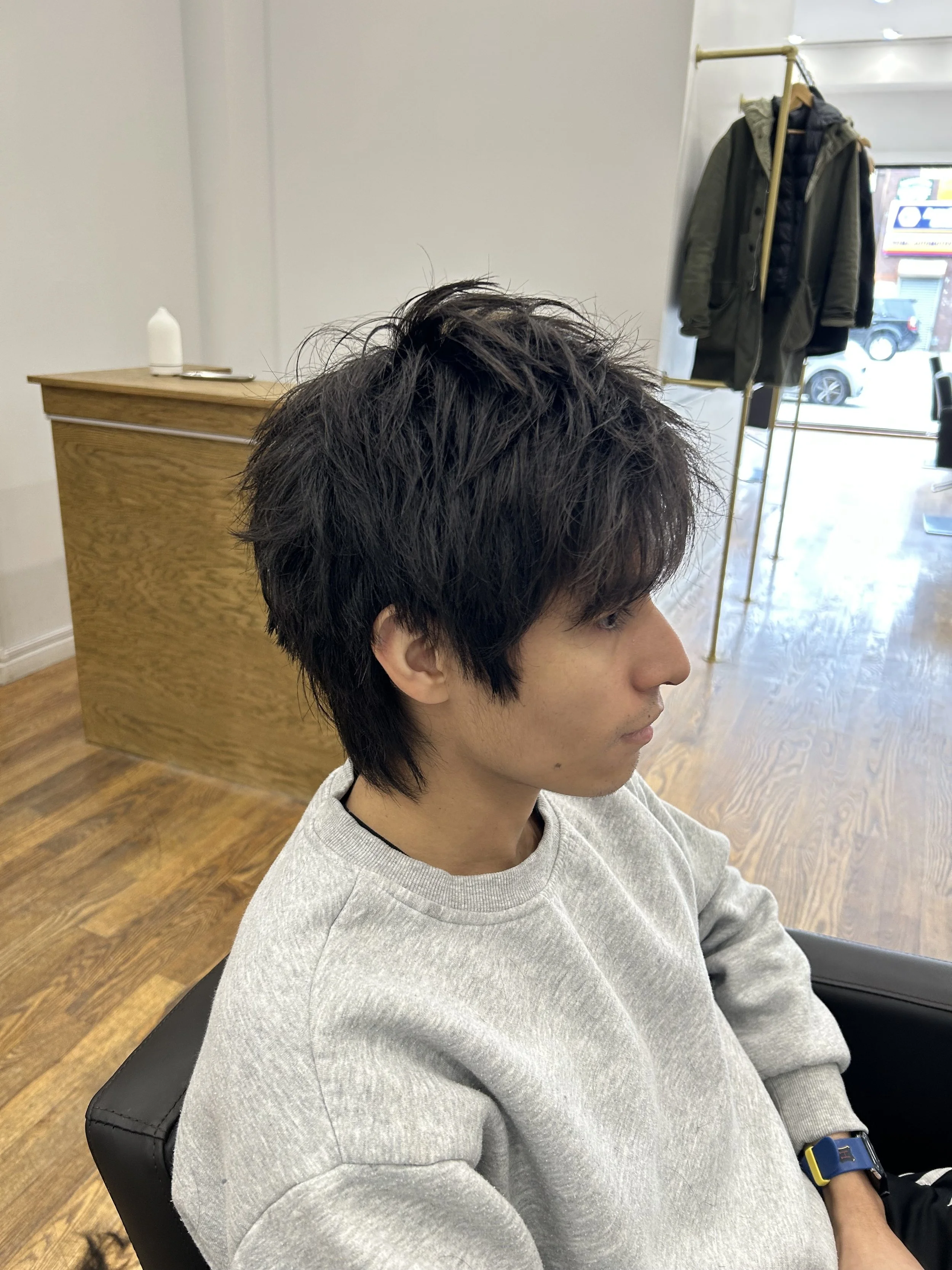 A modern men’s haircut in NYC, designed with precision and clean structure. This barber cut features soft layering on top with controlled texture and natural movement, while the sides and back are shaped to maintain a sharp yet effortless finish. Per