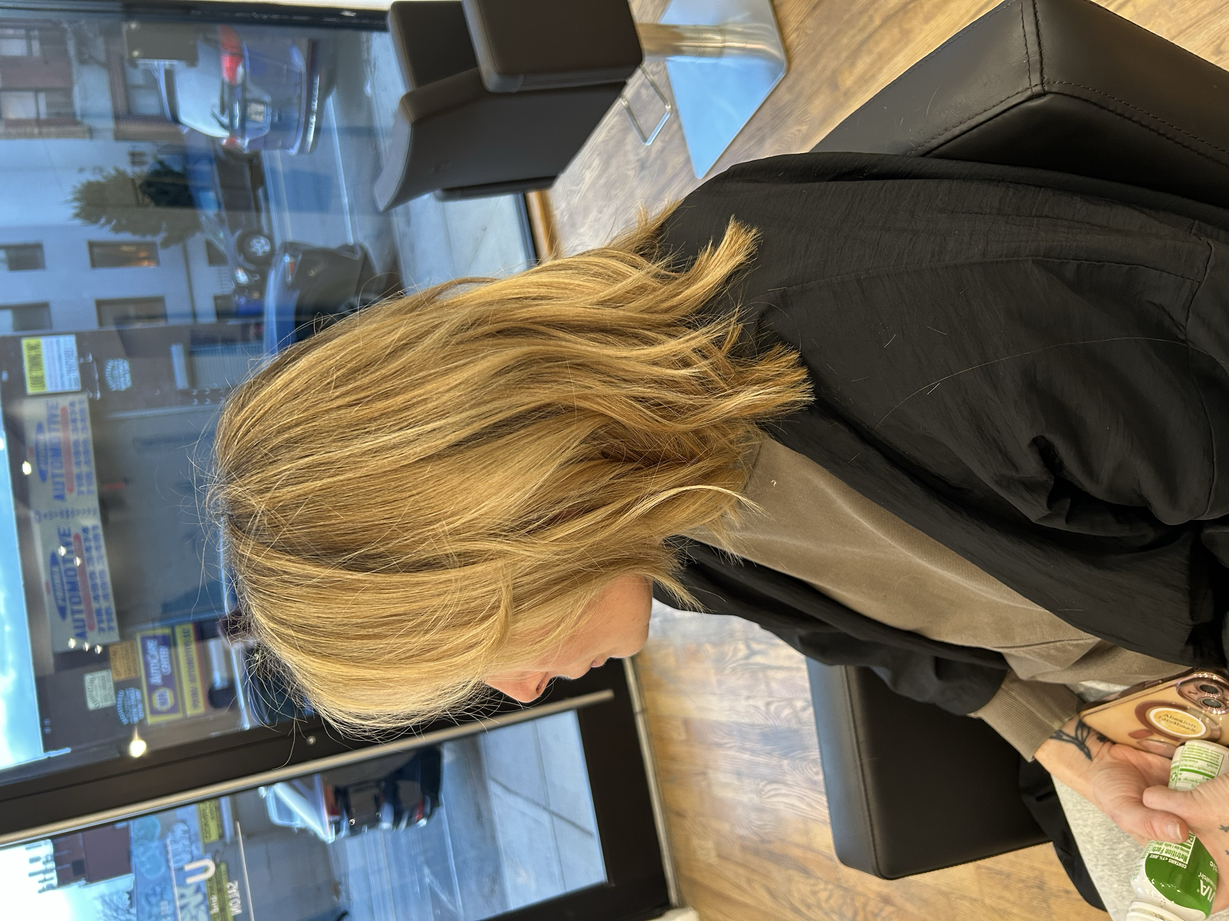Medium-length golden blonde hair with layered styling and lighter strands at U&K Salon in Brooklyn.