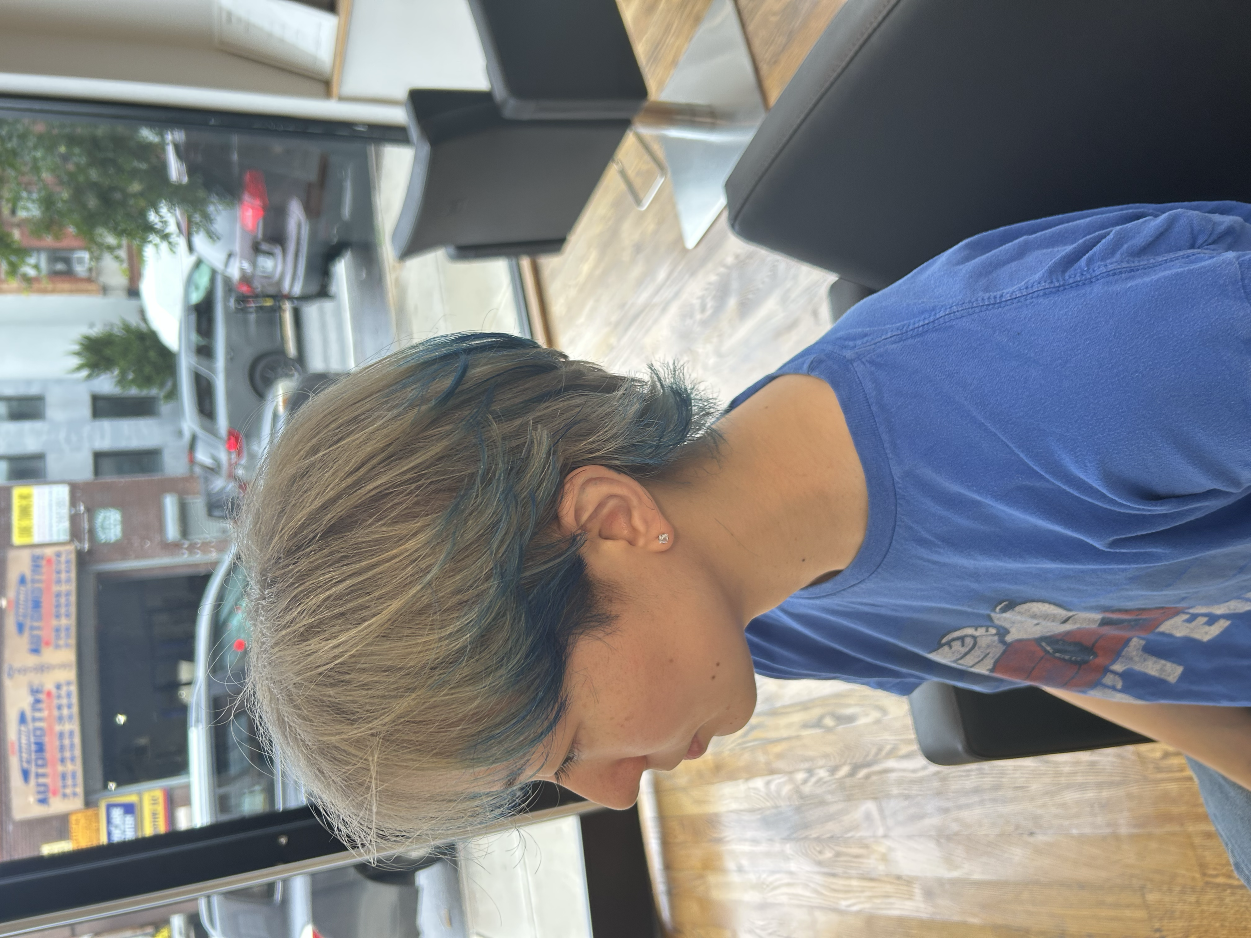 Short layered hair with blue-toned sections and an ash brown base at U&K Salon in Brooklyn.