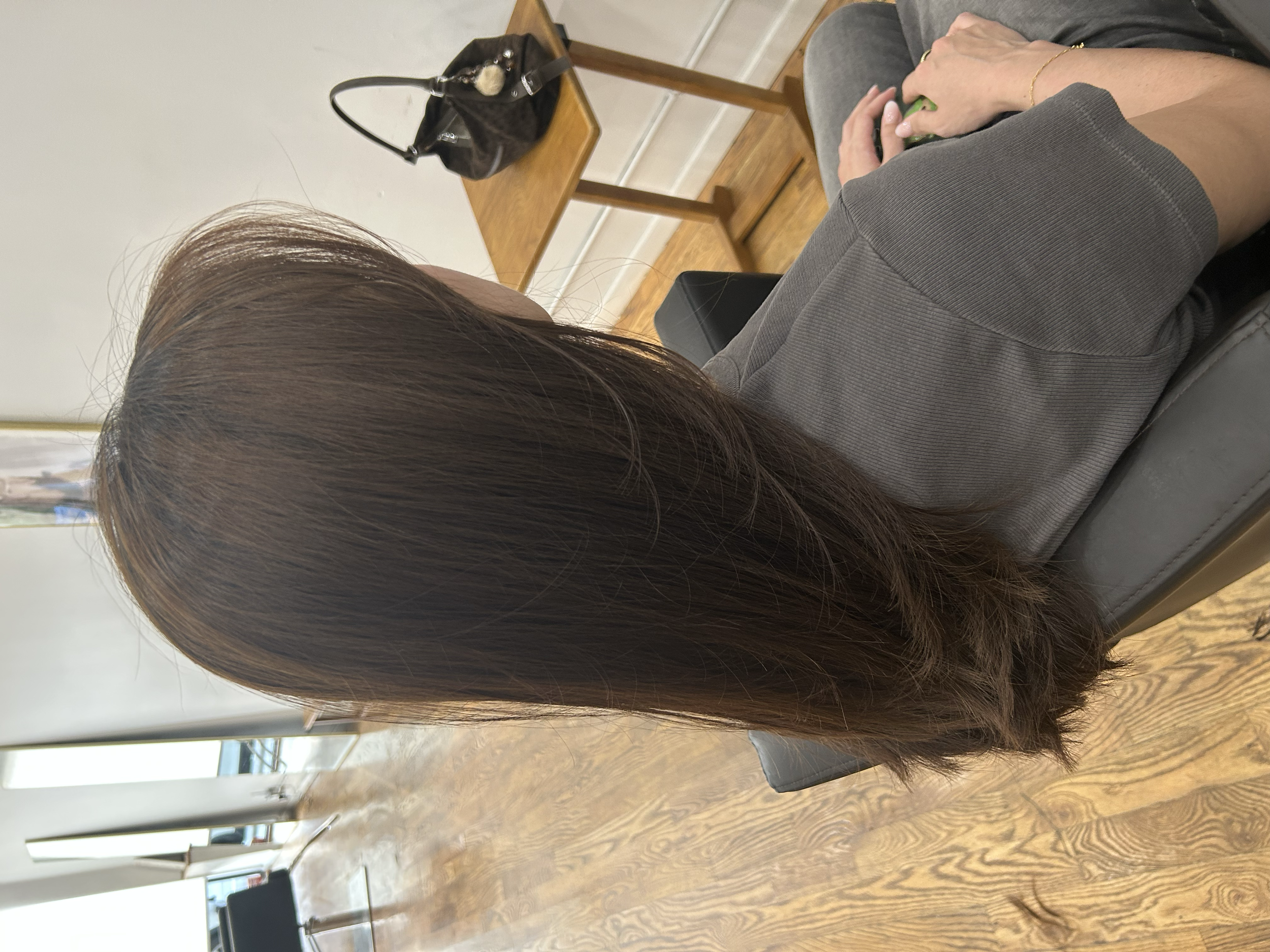 Long chocolate brown hair with subtle layers and a glossy finish at U&K Salon in Brooklyn.