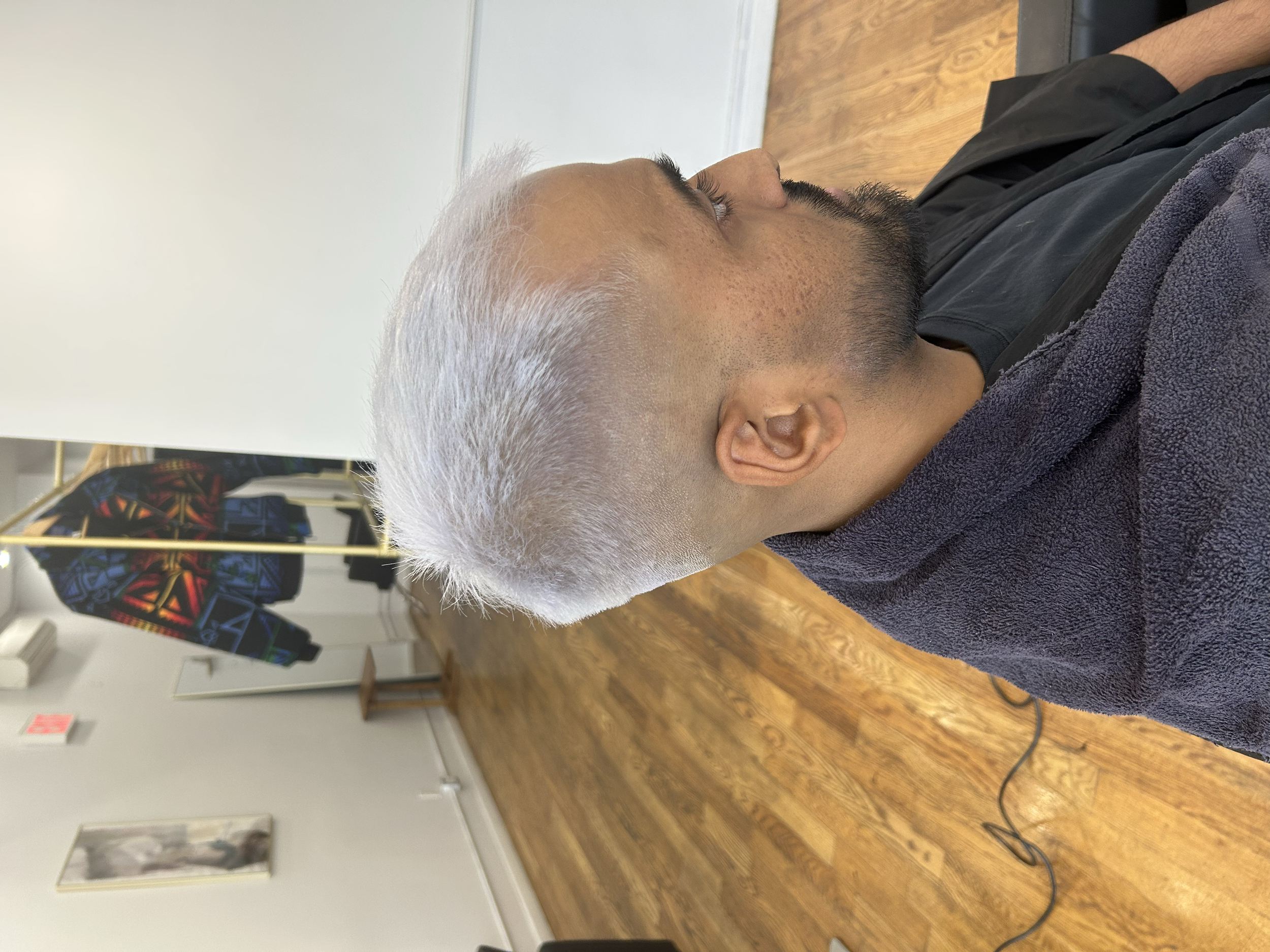Very short platinum blonde hair with a close fade on the sides at U&K Salon in Brooklyn.