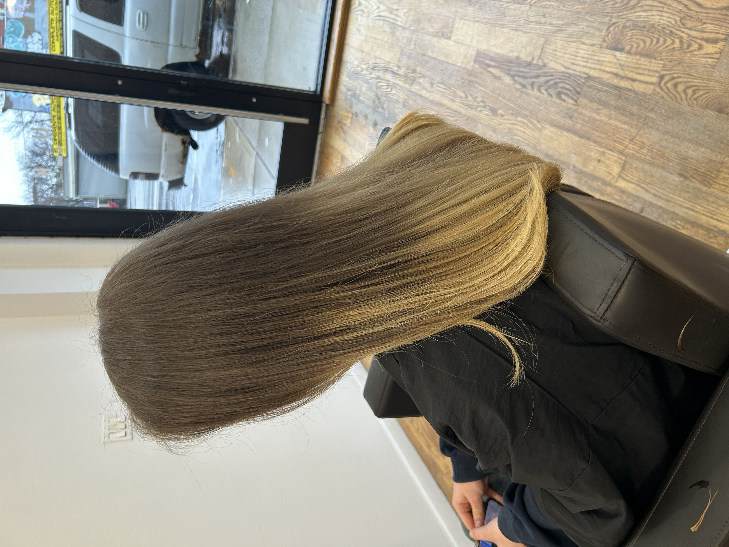 Smooth brown-to-blonde hair with softly styled ends after Brazilian Blowout keratin smoothing at U&K Salon in Brooklyn.