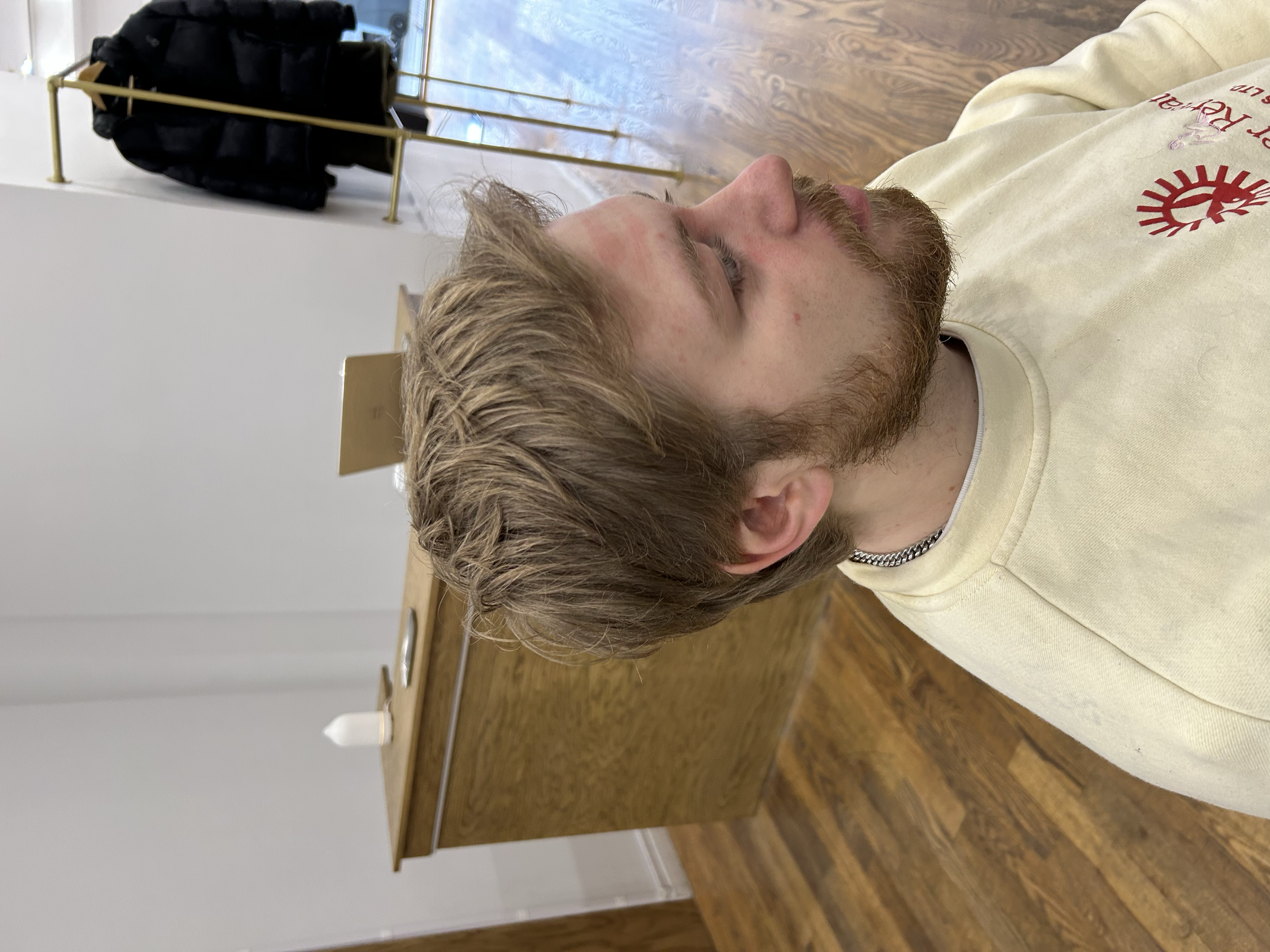 Natural short haircut with soft layers, side-swept texture, and a relaxed finish at U&K Salon in Brooklyn.