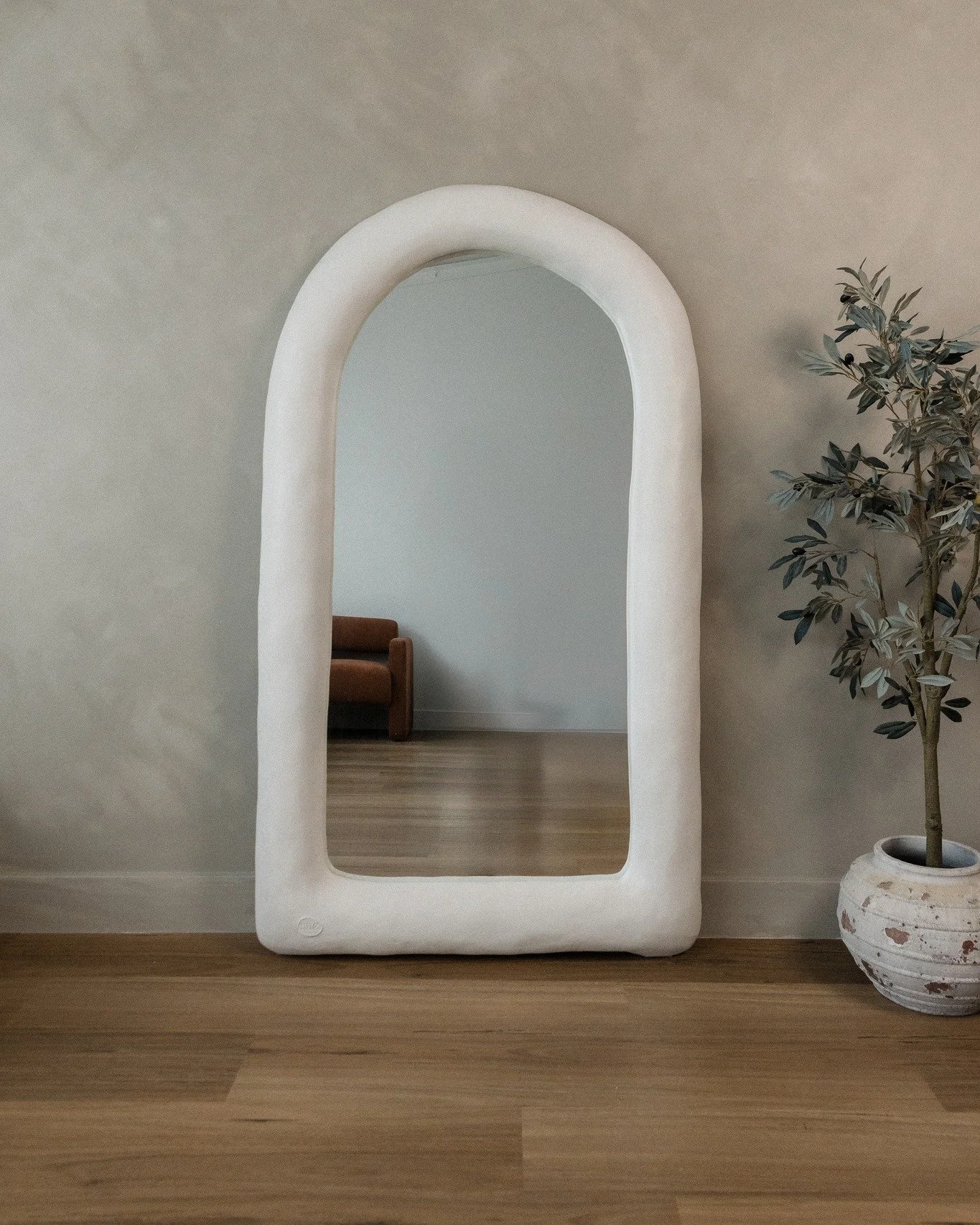 Not just a mirror - an atmosphere. 

The Andros Arch Mirror softens  a space the moment it enters. 
Curved, sculptural and quietly commanding.. it doesn&rsquo;t ask for attention, it holds it.

In a boutique, it elevates every piece around it.
In a s