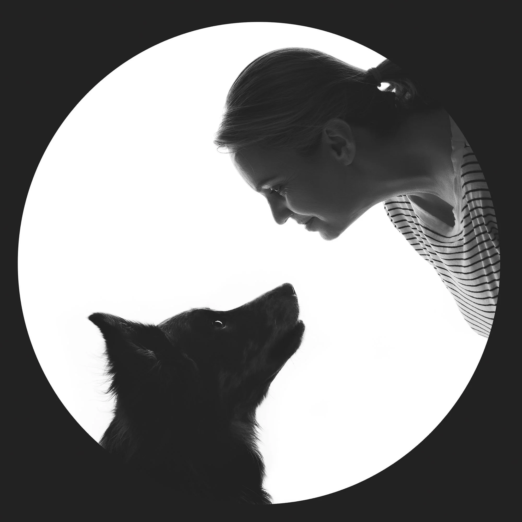 Black and white photo of a dog and his owner taken by a professional photographer in Paralowie