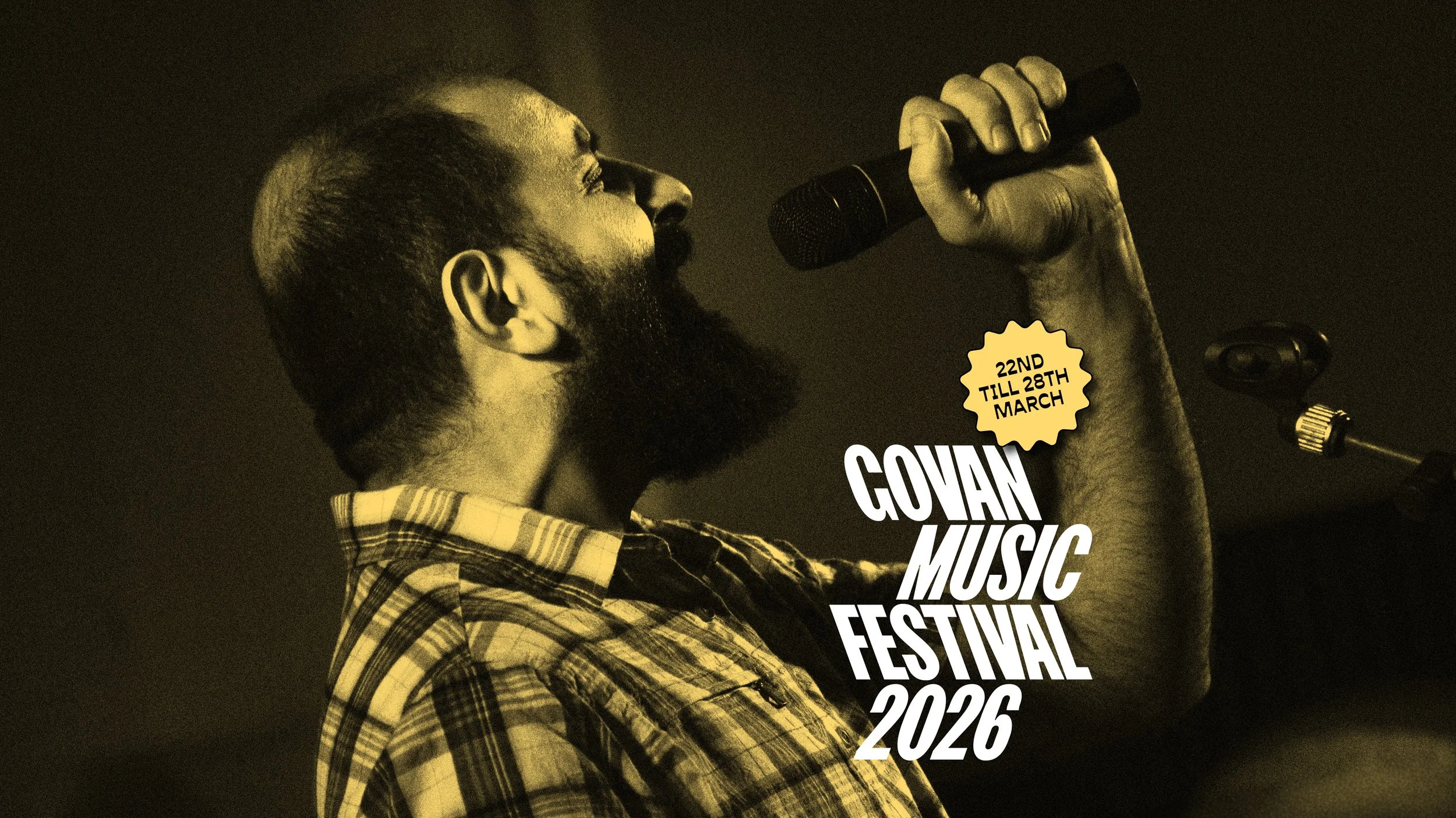 man singing into microphone