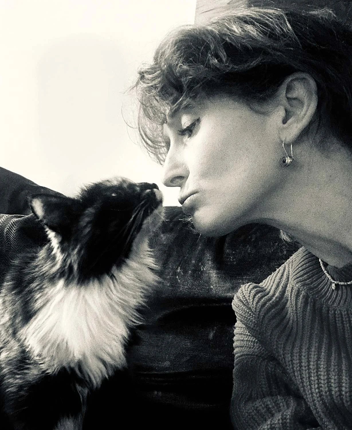 Black and white photo of Artist Alice Boyle with her cat Shakira
