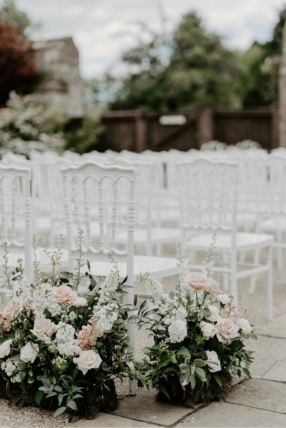 blush and white flower meadows for an outside ceremony at Caswell House