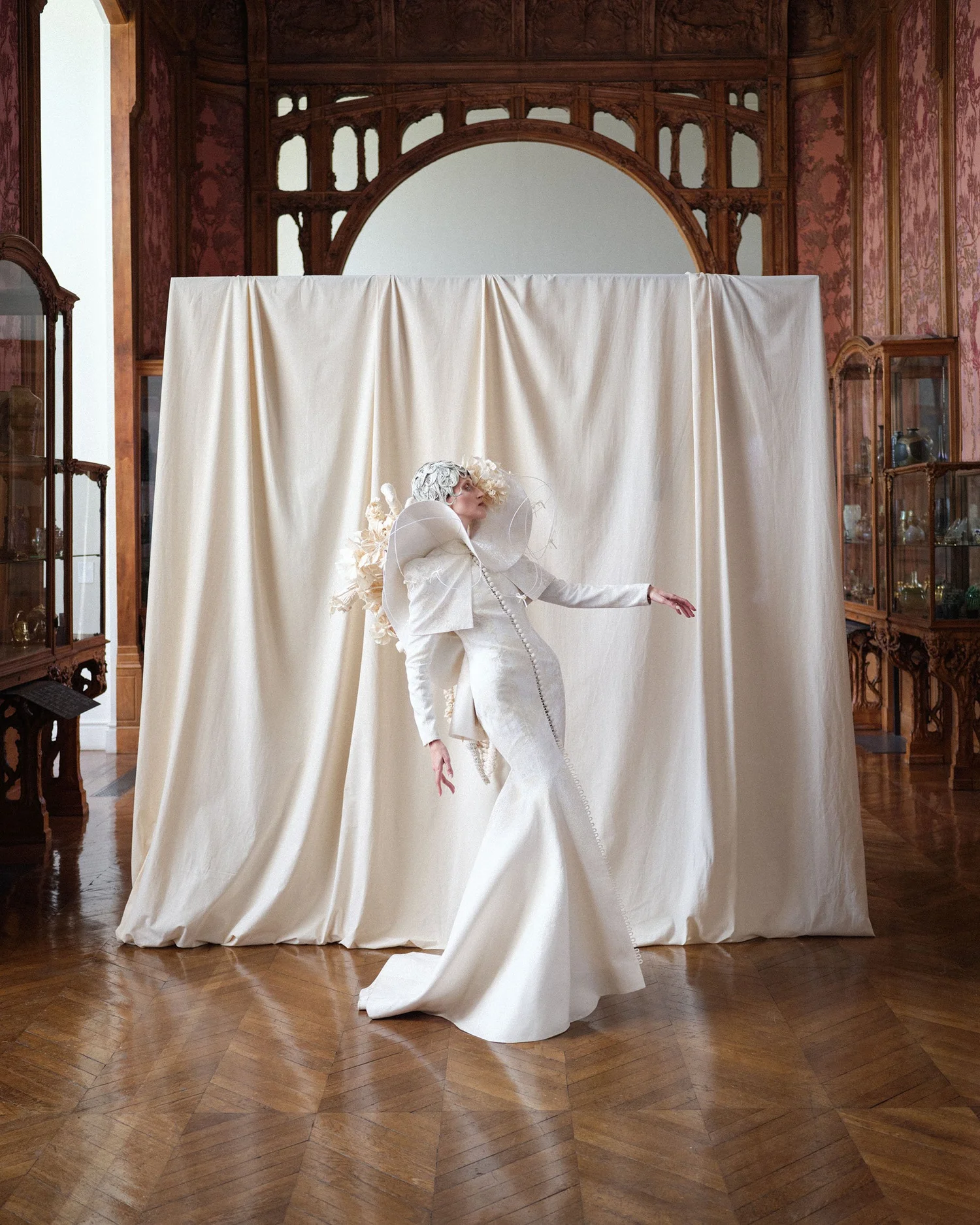 thom browne wedding dress here comes the bride  behind the scenes at the thom browne couture 2023  show. grace elizabeth wears a tailored white dress with transparent radial  stitch beadwork throughout and a ten-foot
