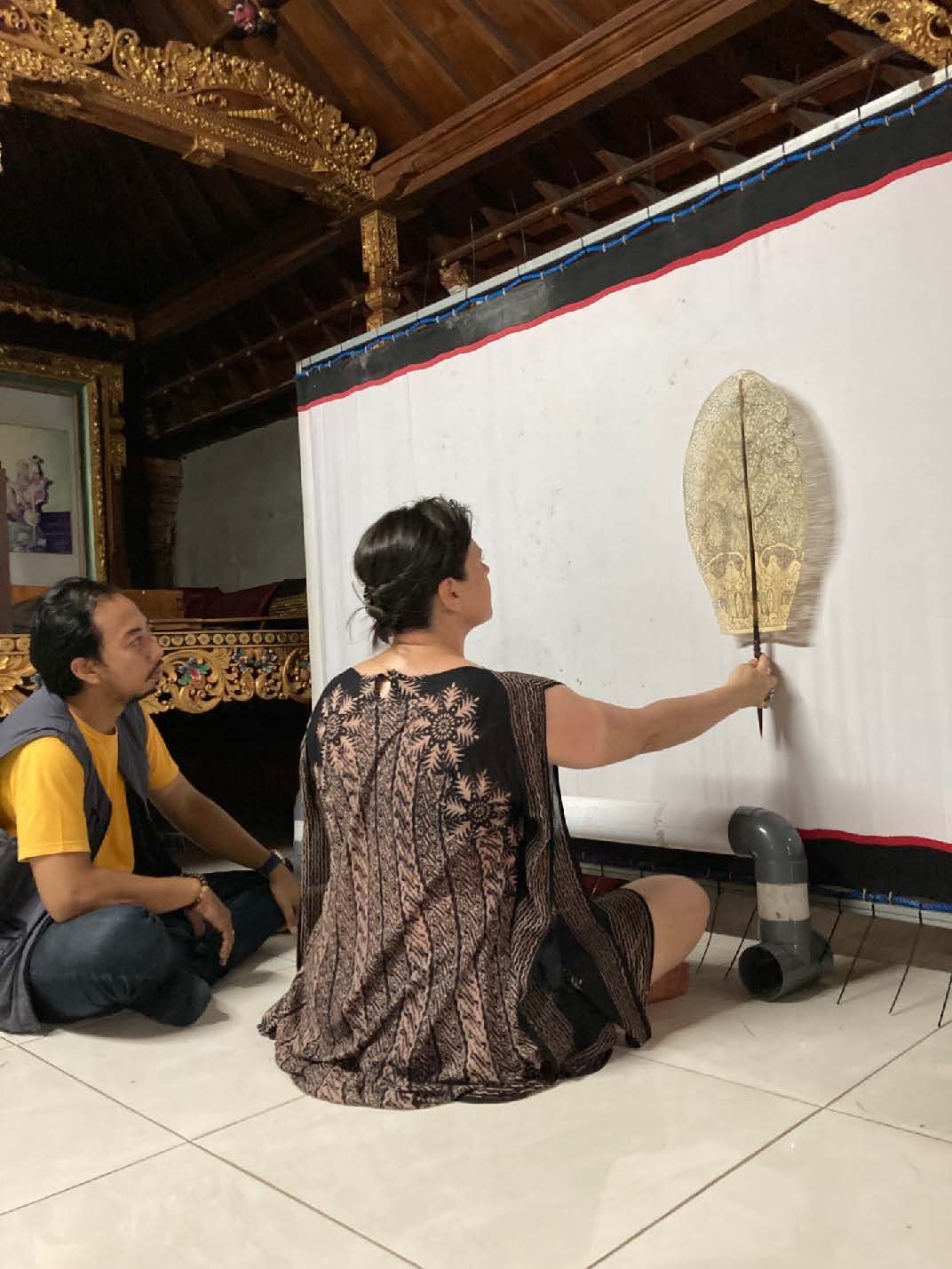 Trying wayang kulit (shadow puppetry) with dalang Gung Ade in Bali