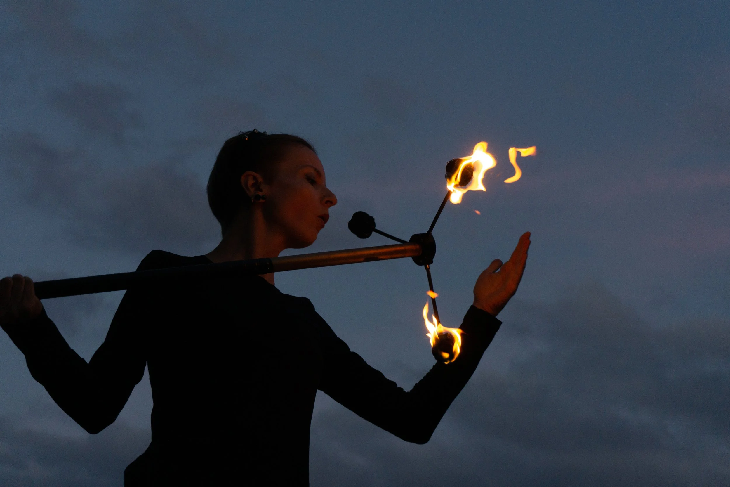 Elena Tinkloh exhaling during flow arts practice — embodied regulation and burnout prevention