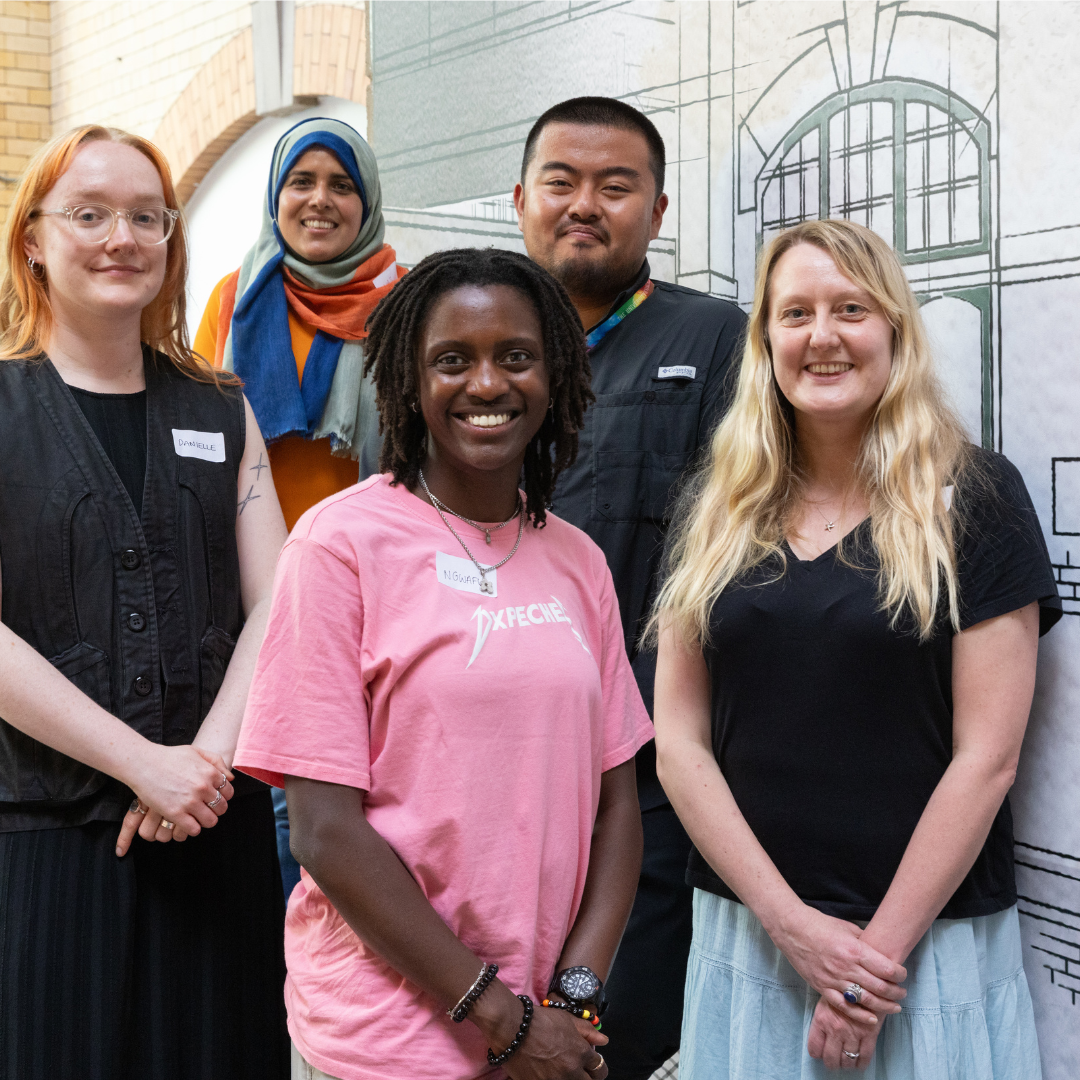 Some Steering Group members smiling to camera