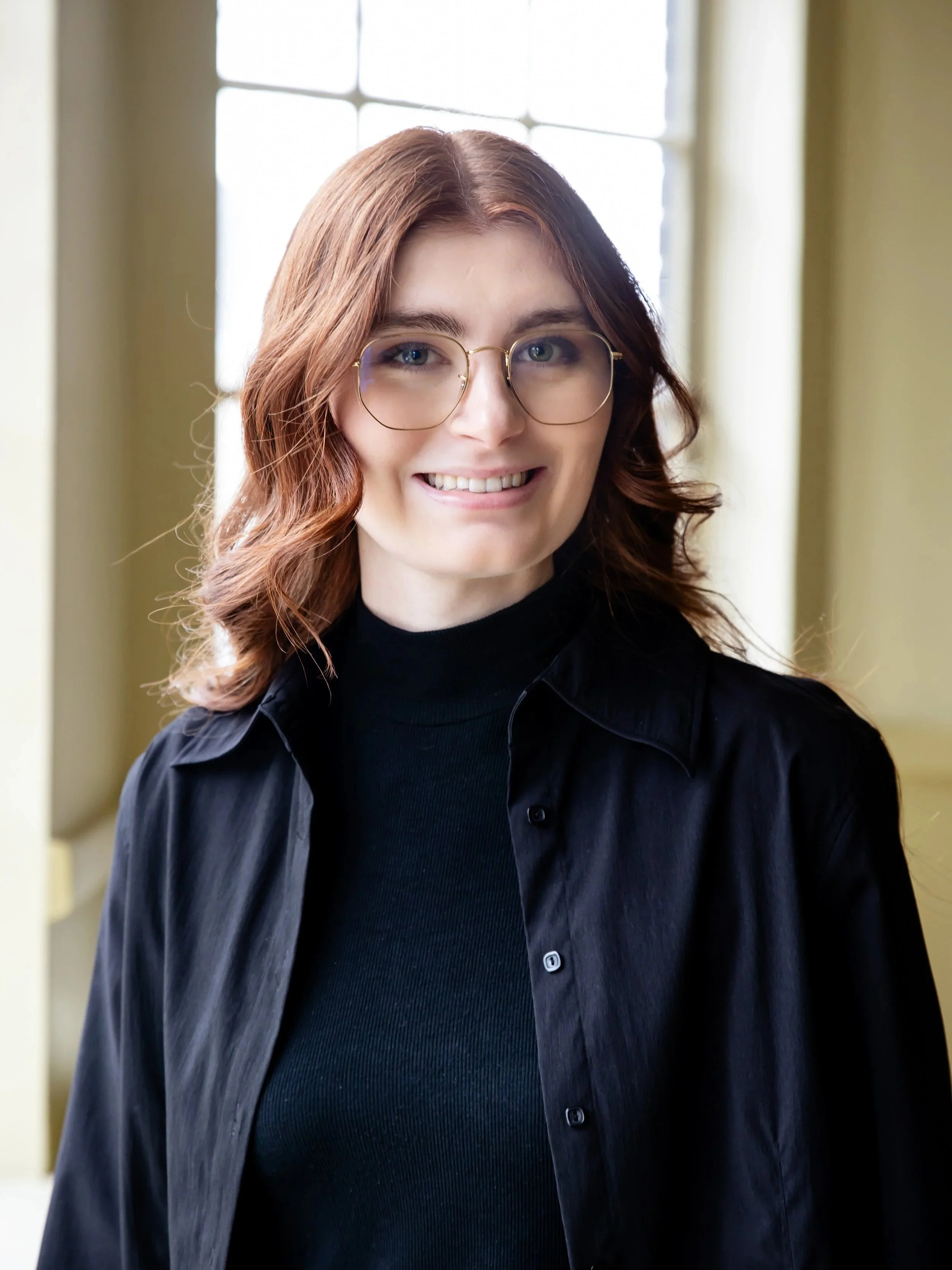 Maddi, wedding dog attendant with Black Dog Weddings, preparing a dog for a wedding ceremony.