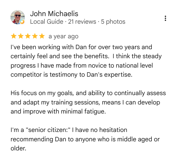 Screenshot of a customer review for John Michaelis, a local guide, praising Dan's training expertise, mentioning progress from novice to national level, and recommending him for middle-aged and older individuals.