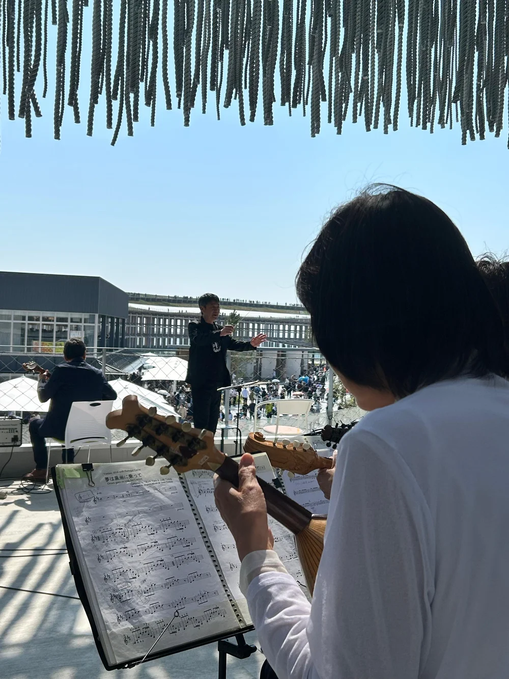 The exhibition opening featured a unique collaboration: MUSIC@NET with an extended mandolin and guitar orchestra led by Mr. Yoshida.