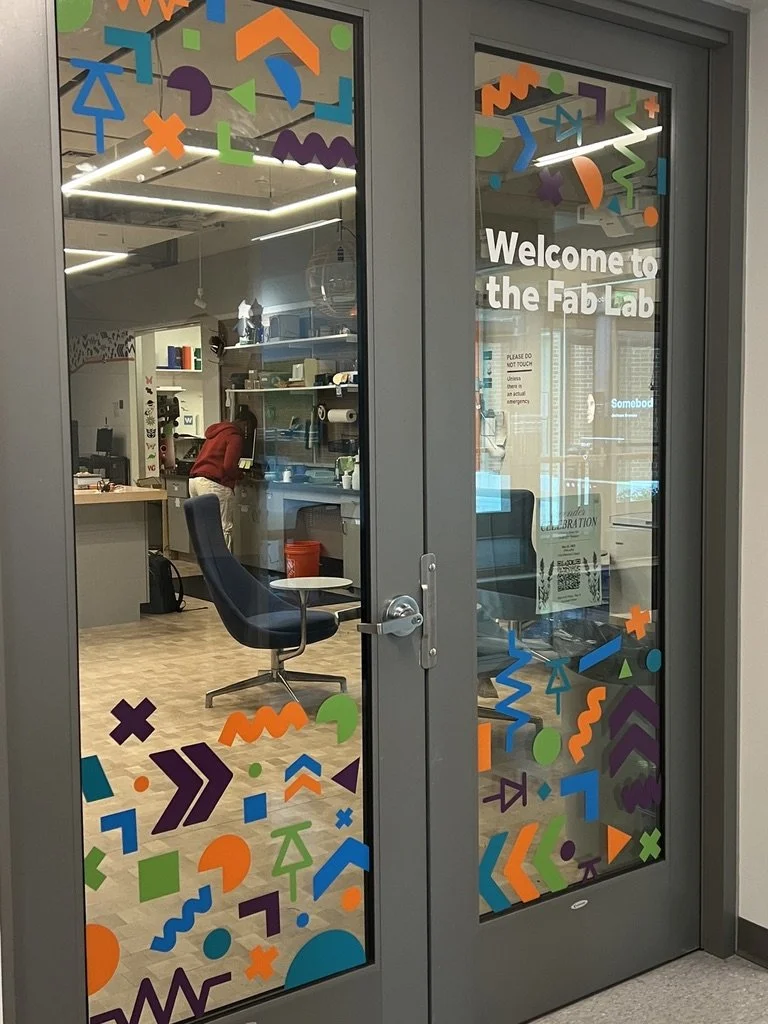 Colorful doors on the Wheaton College Fab Lab designed by students