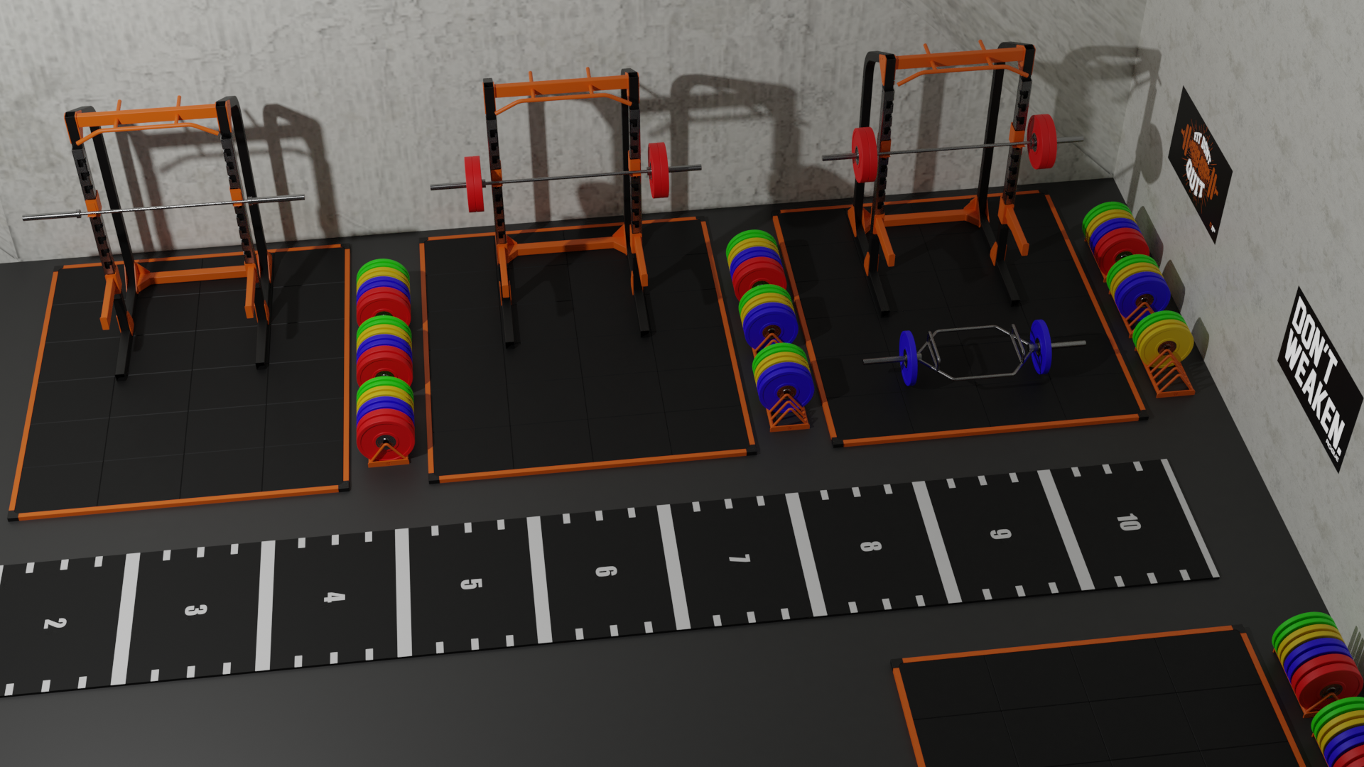 Gym equipment setup with weightlifting and workout stations on black mats, colorful weight plates, a small weight bar, and motivational posters on the wall.