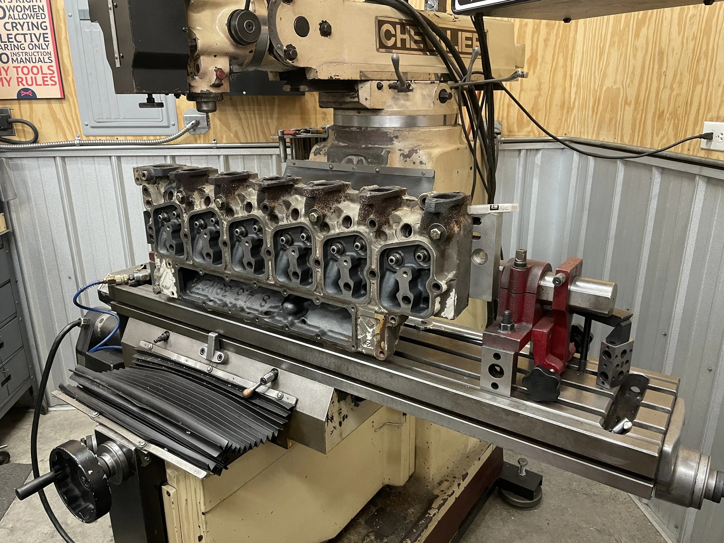 Industrial Cummins 12 Valve cylinder head bolt extraction surfacing and repair on knee mill