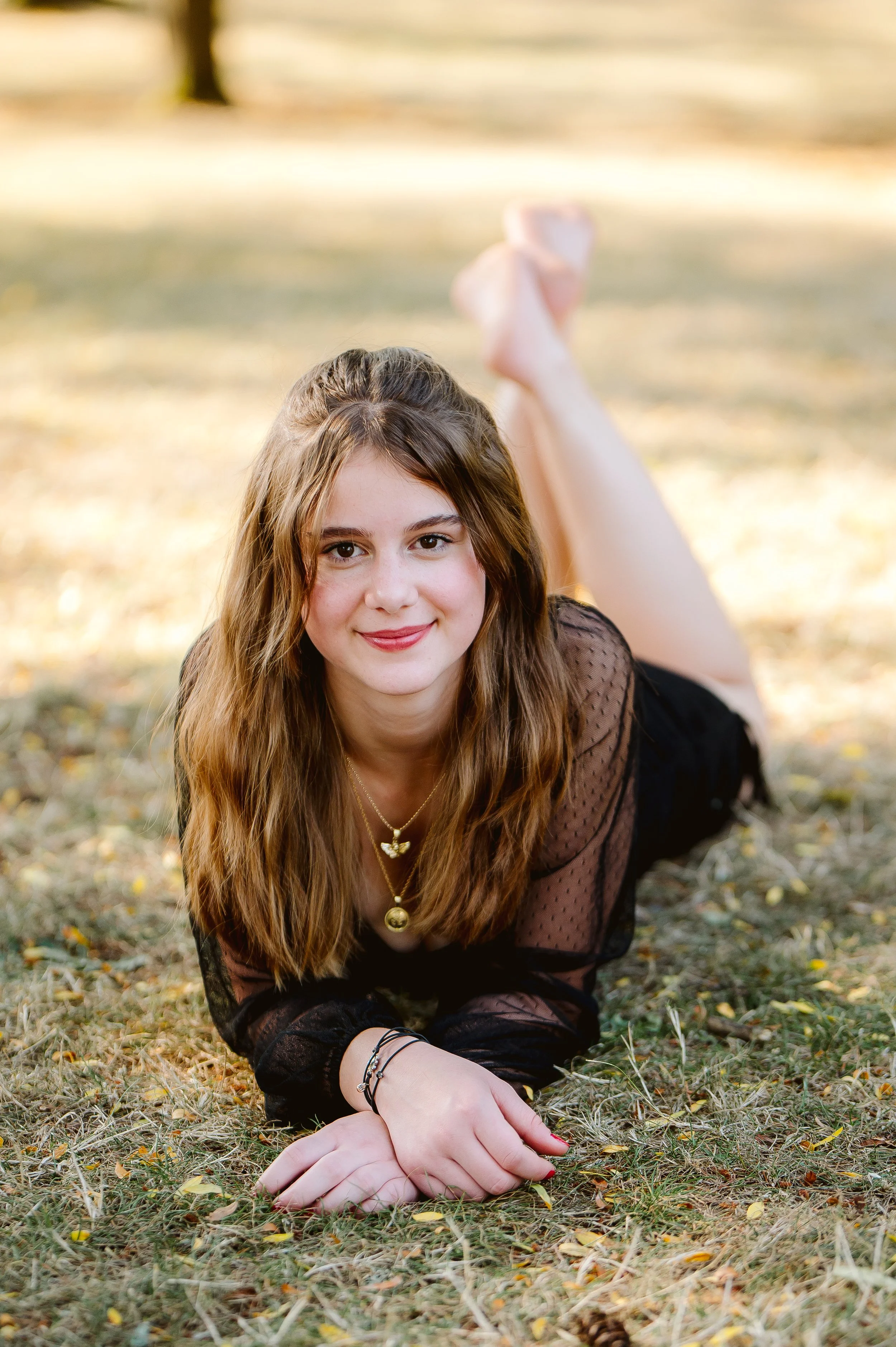 Outdoor senior portrait captured in Vancouver Washington with warm tones, natural light, and a relaxed pose.