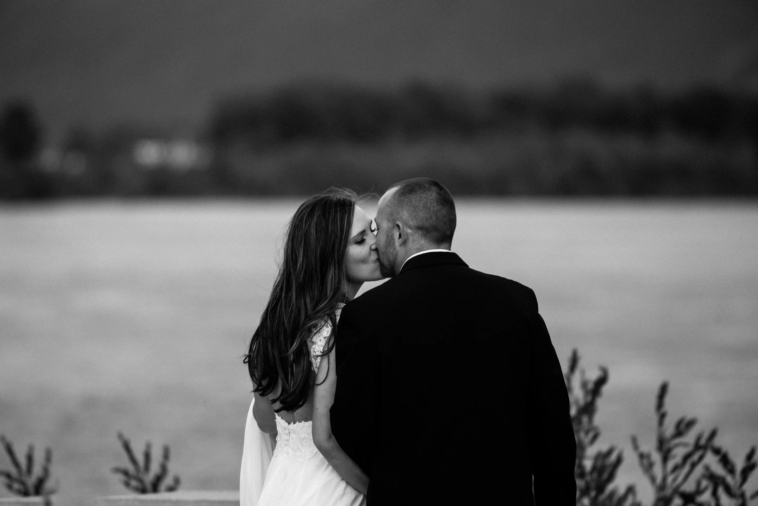 Couple sharing a kiss during intimate wedding in Vancouver Washington