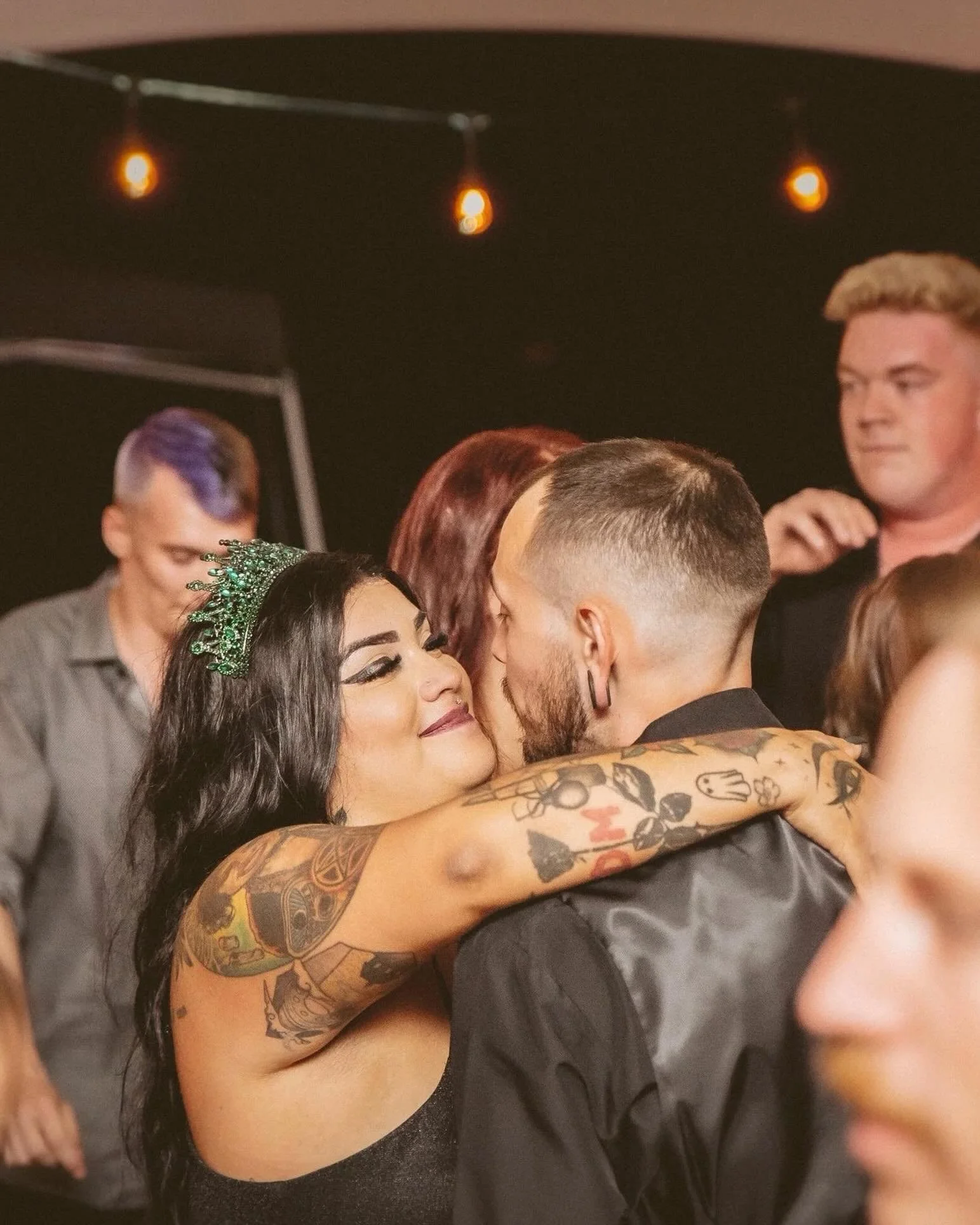 Some wedding photos feel like the room sounded.

The music is loud, people are packed onto the dance floor, and the couple finally gets to be in the middle of the party they planned. These are the photos that bring back the energy of the night, not j