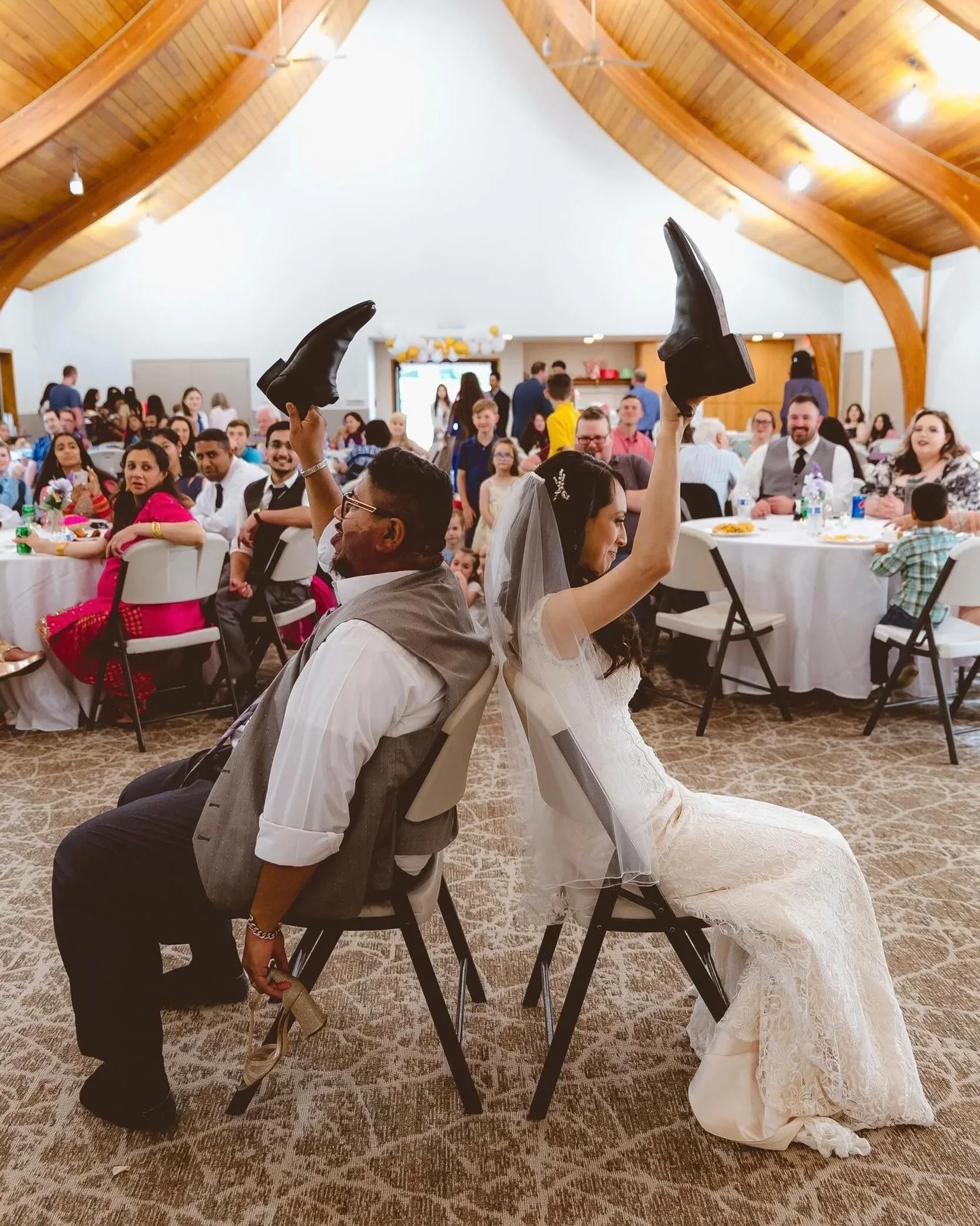 Reception games always bring out the best reactions.

The shoe game is one of those parts of a wedding day where people relax, laugh a little louder, and forget about the timeline for a few minutes. It gives guests something to react to, and it gives