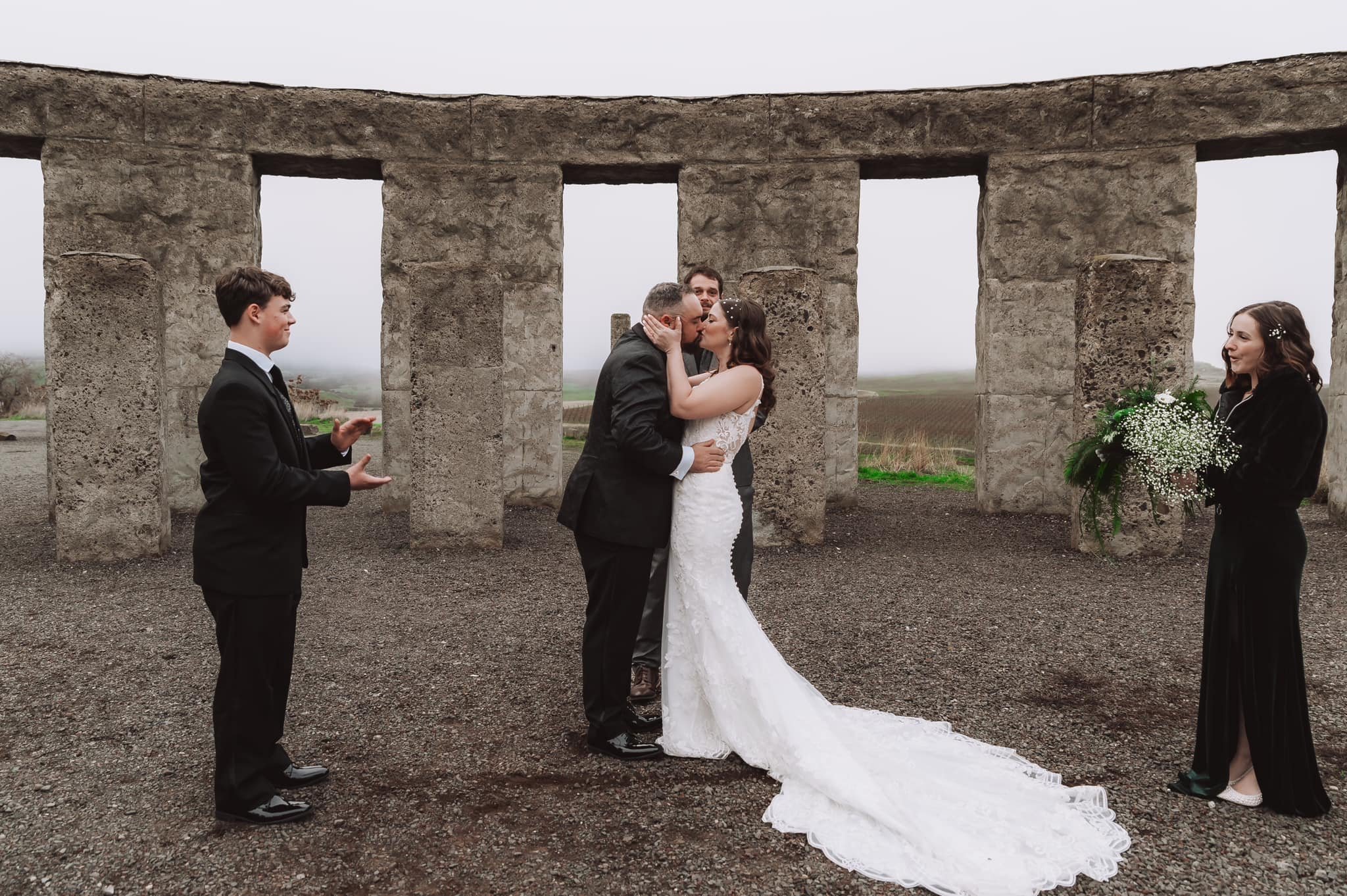 Bride and groom exchanging private vows during an Oregon elopement on a cliffside at sunset