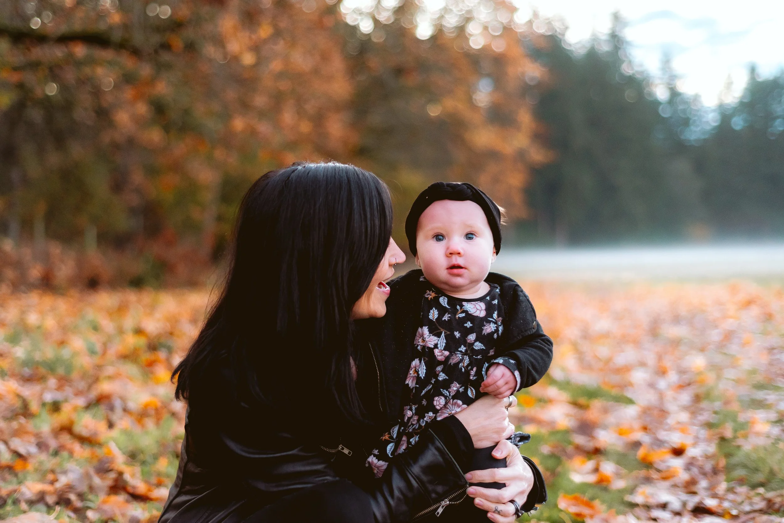 Baby and parent photography in Vancouver, Washington showcasing a quiet, emotional moment during an autumn family session.
