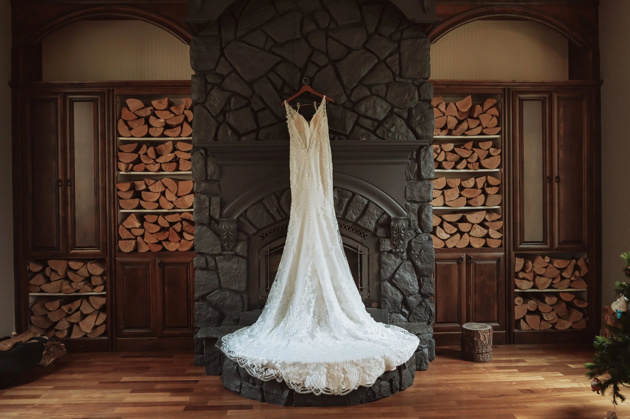 Wedding dress hanging indoors photographed by a Vancouver WA wedding photographer