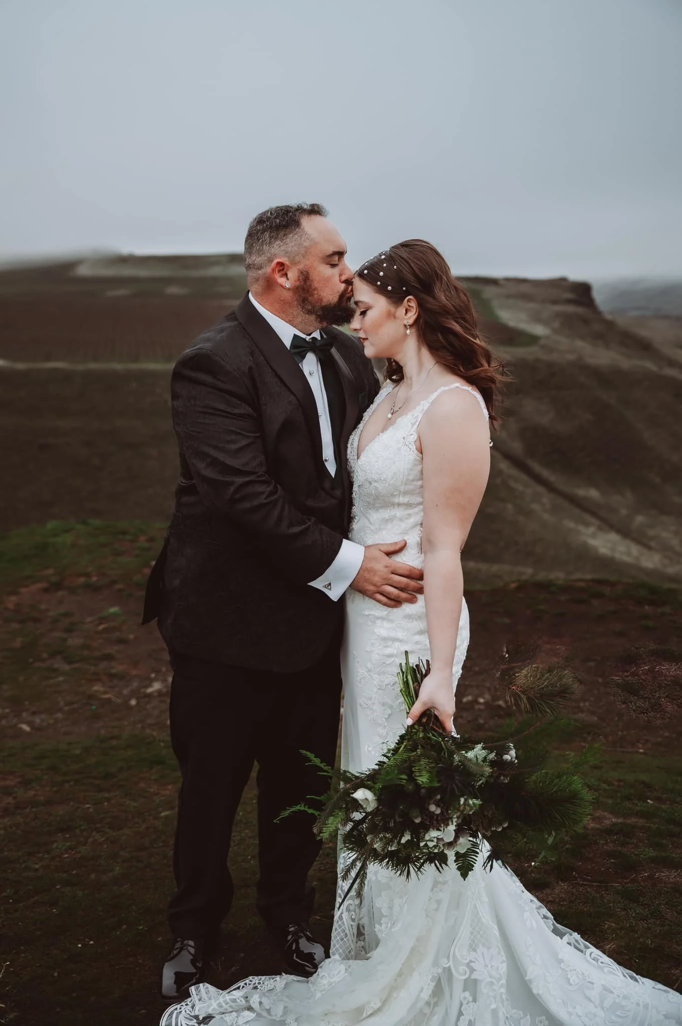 Romantic outdoor wedding portrait of a couple embracing, photographed by a Vancouver, Washington wedding and elopement photographer in the Pacific Northwest.