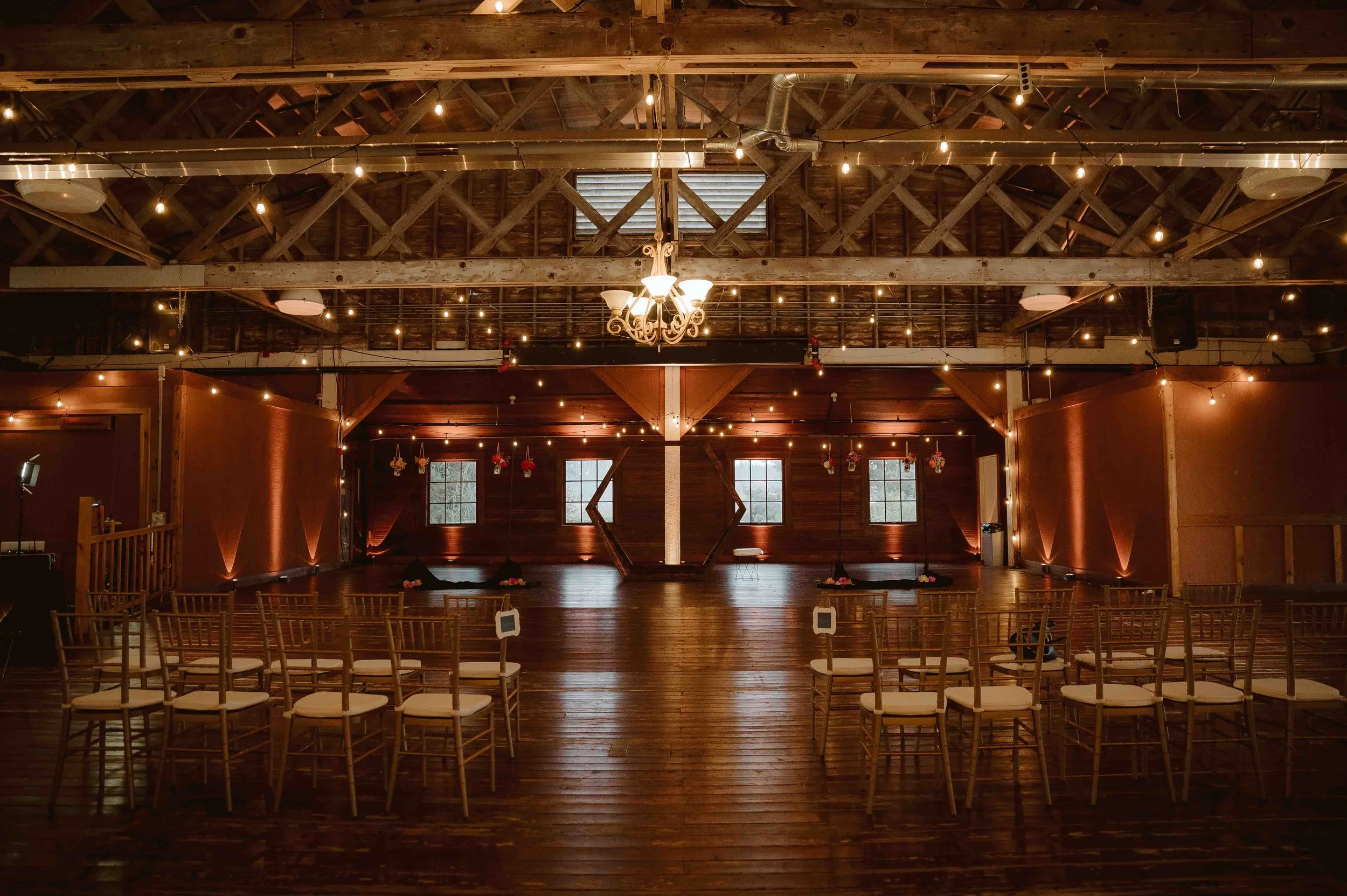 Small wedding reception with string lights candlelight and romantic evening atmosphere