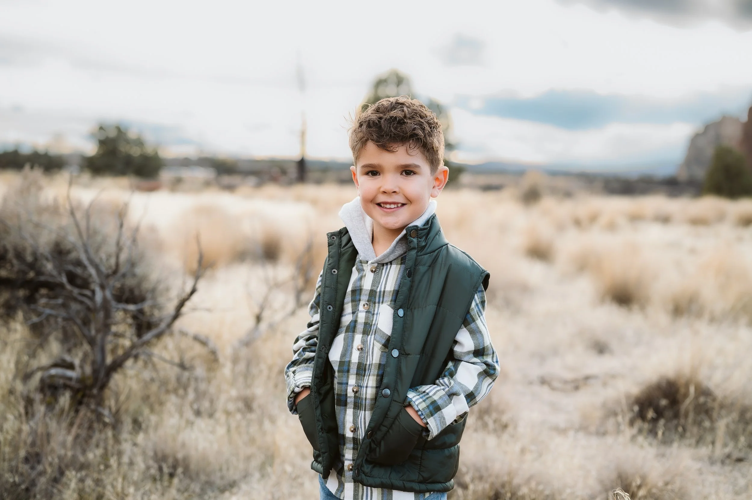 Natural outdoor family portrait photographed by a Vancouver Washington photographer in a scenic landscape.
