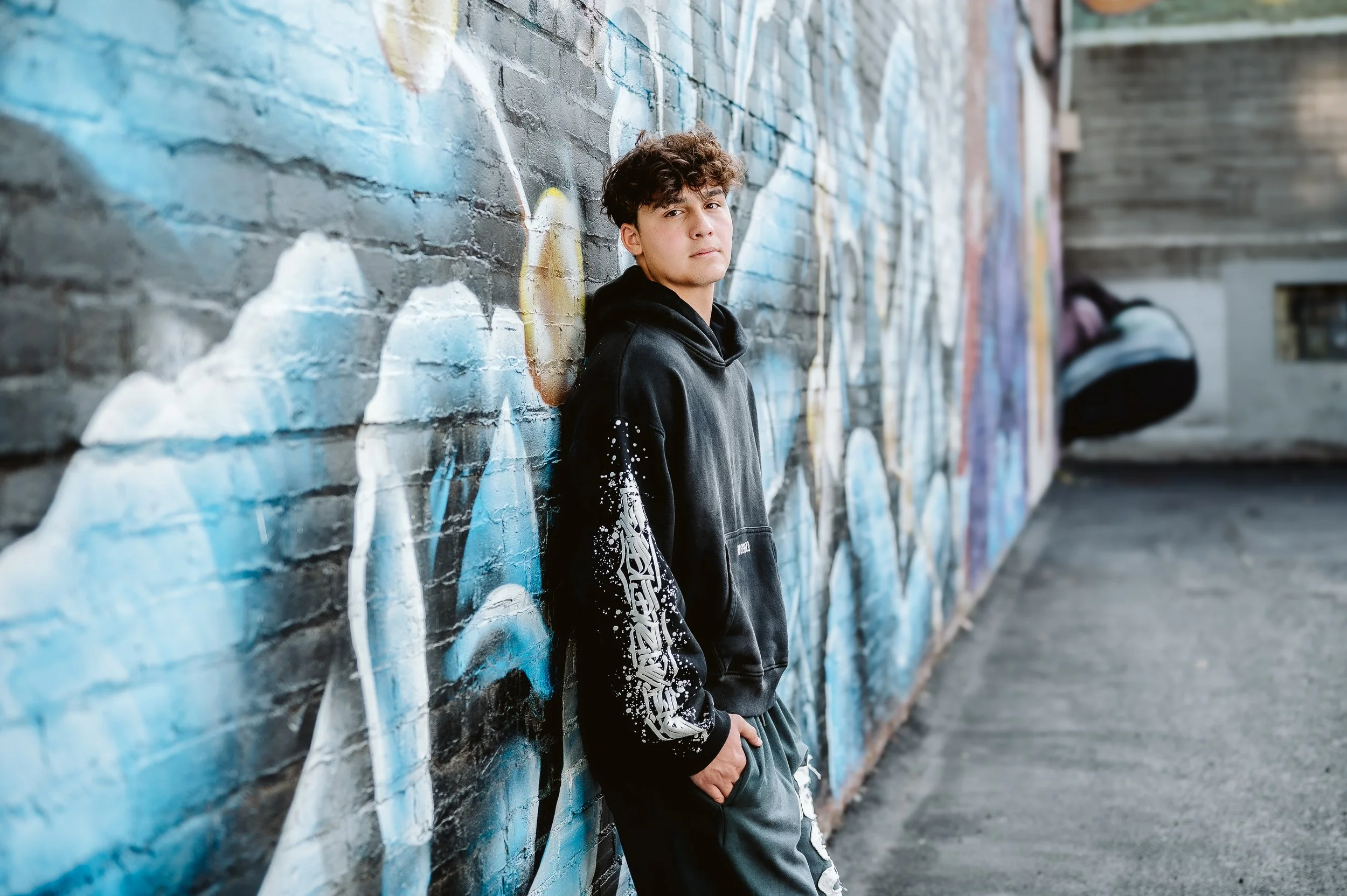 High school senior photography in Portland, Oregon using murals and city textures for a modern look.