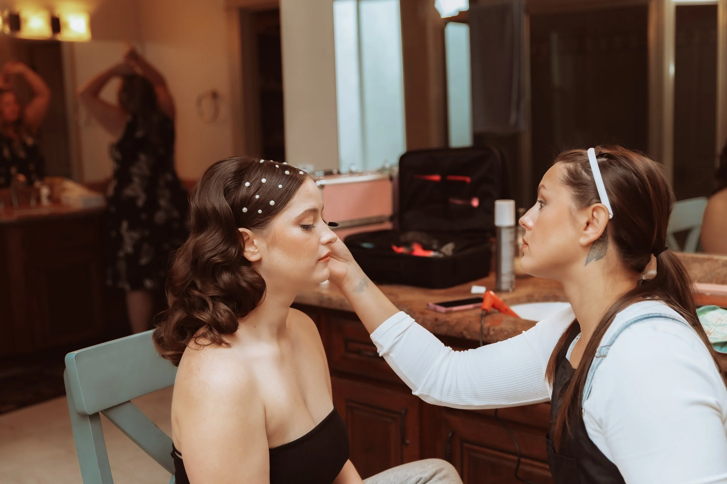 Bride getting makeup done before intimate wedding in Vancouver Washington