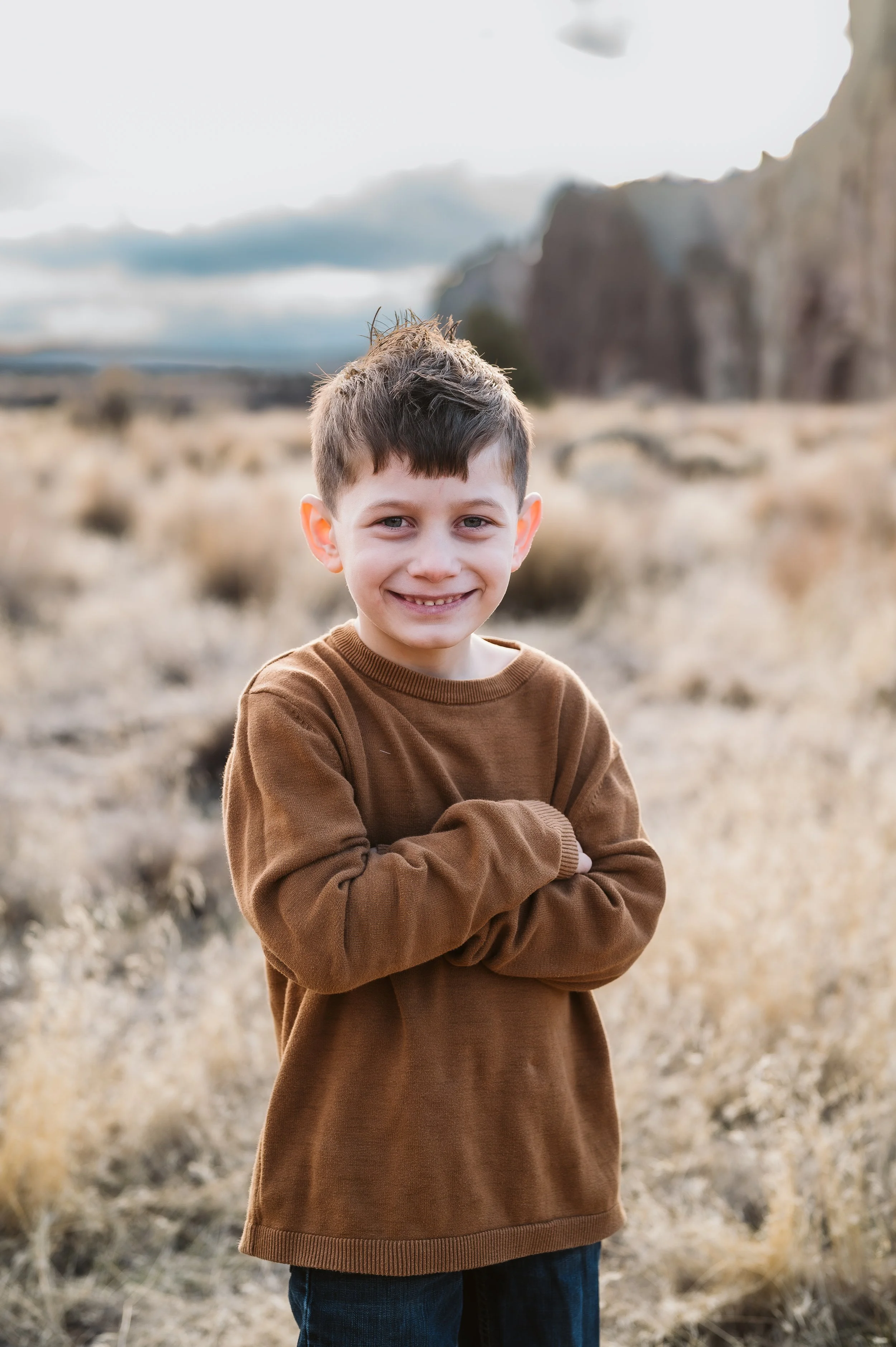 Outdoor family photography portrait captured by a Vancouver Washington photographer in a natural open landscape.
