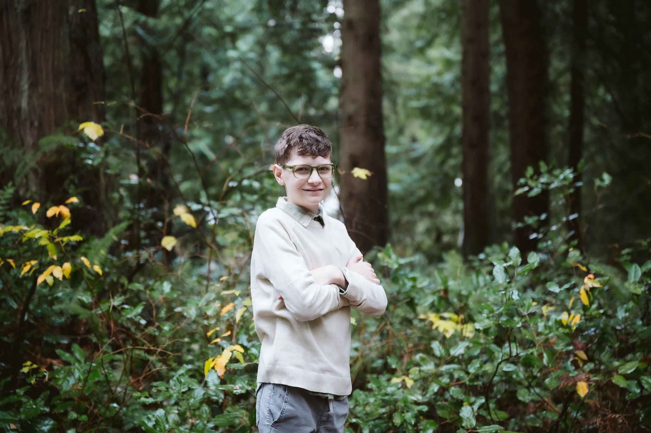 Lifestyle child portrait taken during an outdoor family photography session in Vancouver Washington surrounded by natural greenery.
