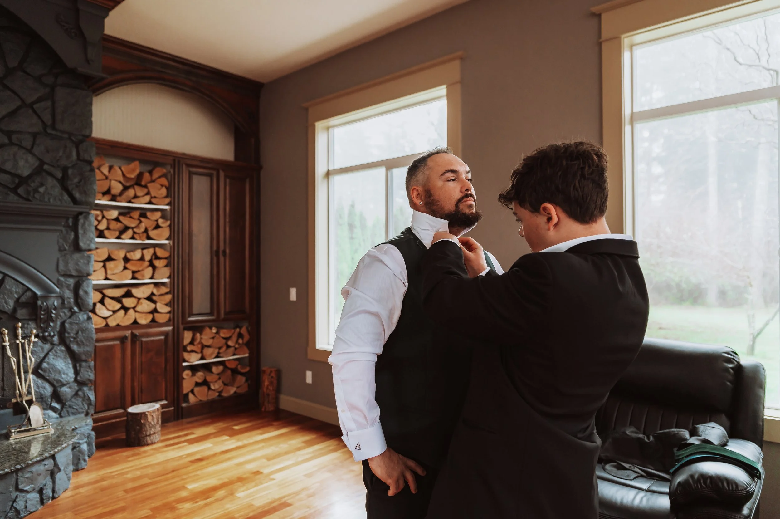 Groom getting ready with help adjusting tie before intimate wedding in Vancouver Washington