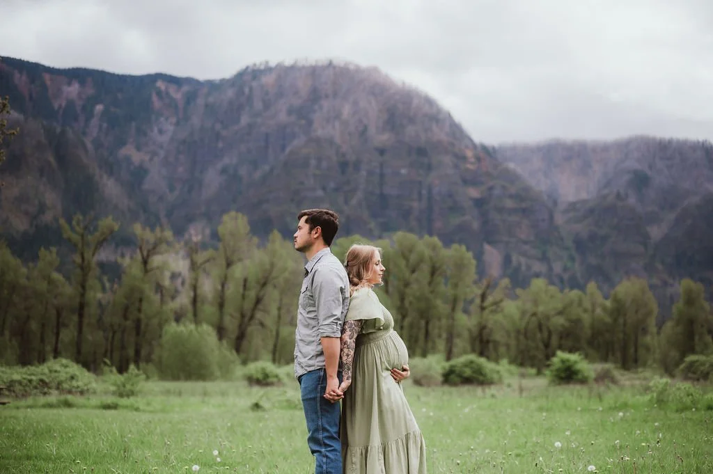Couple holding hands during an outdoor maternity photography session in Vancouver Washington