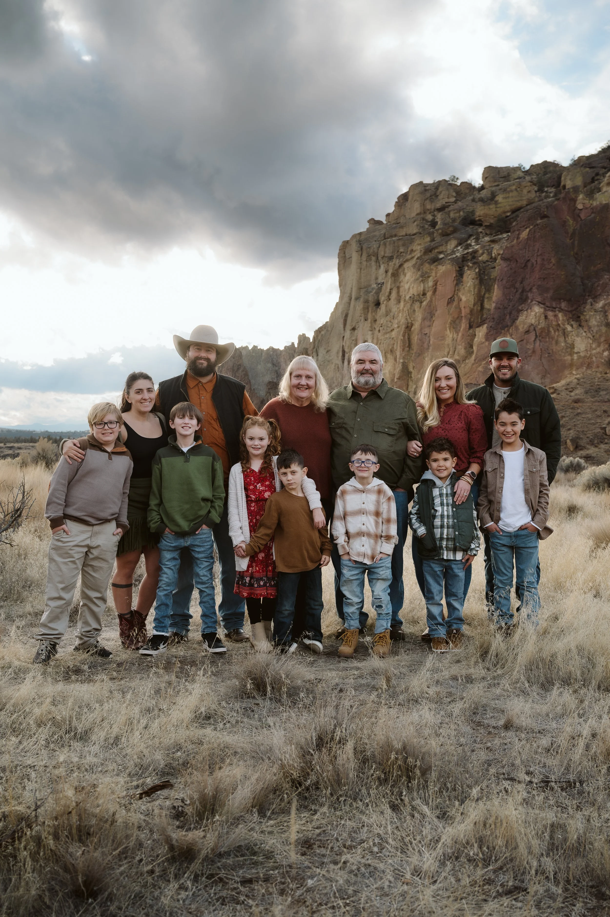 Large family portrait photographed outdoors by a Vancouver, Washington family photographer, capturing multiple generations in a natural Pacific Northwest landscape.