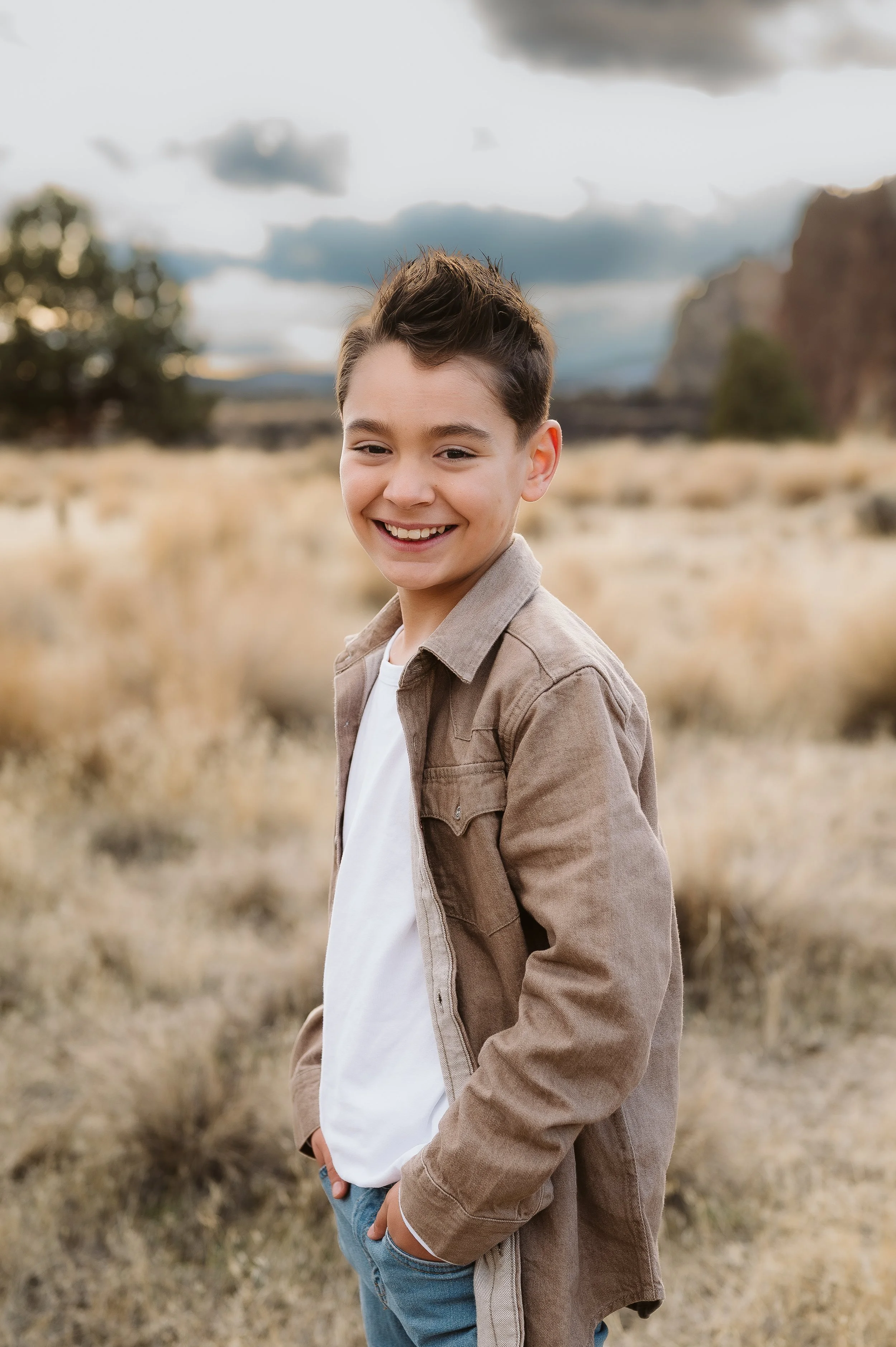 Outdoor family photography portrait captured by a Vancouver Washington photographer in a natural open landscape.
